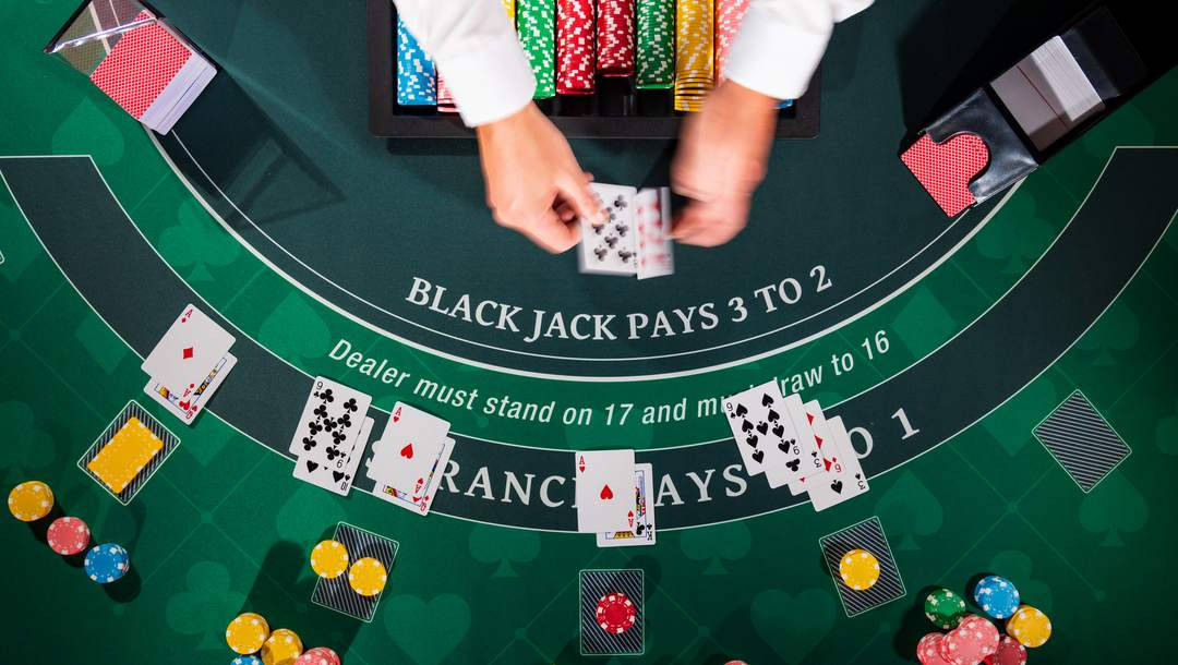 Top-view Shot Of Hands Of The Dealer Baccarat Game Background