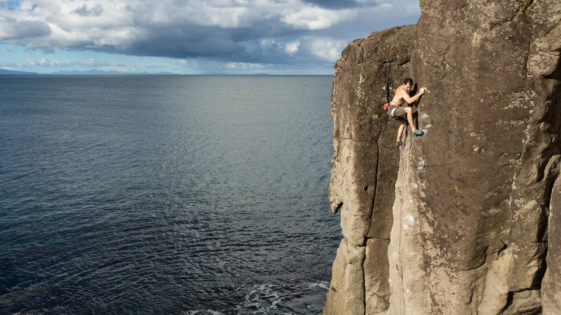 Topless Man Rock Climbing Aerial Photo