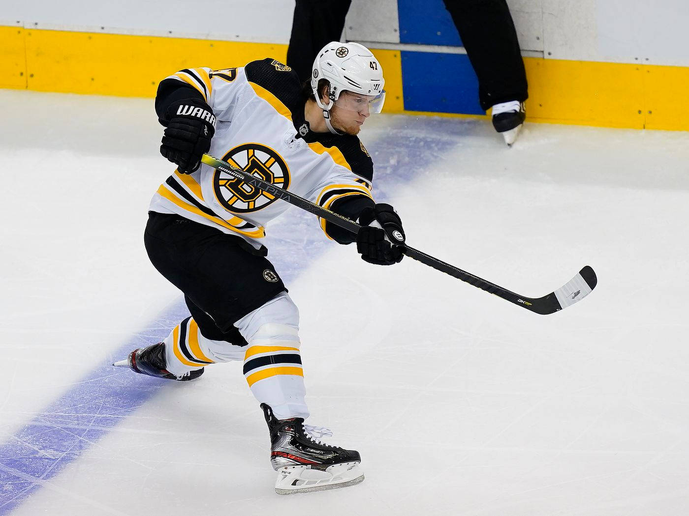 Torey Krug Attempts To Land A Goal Background