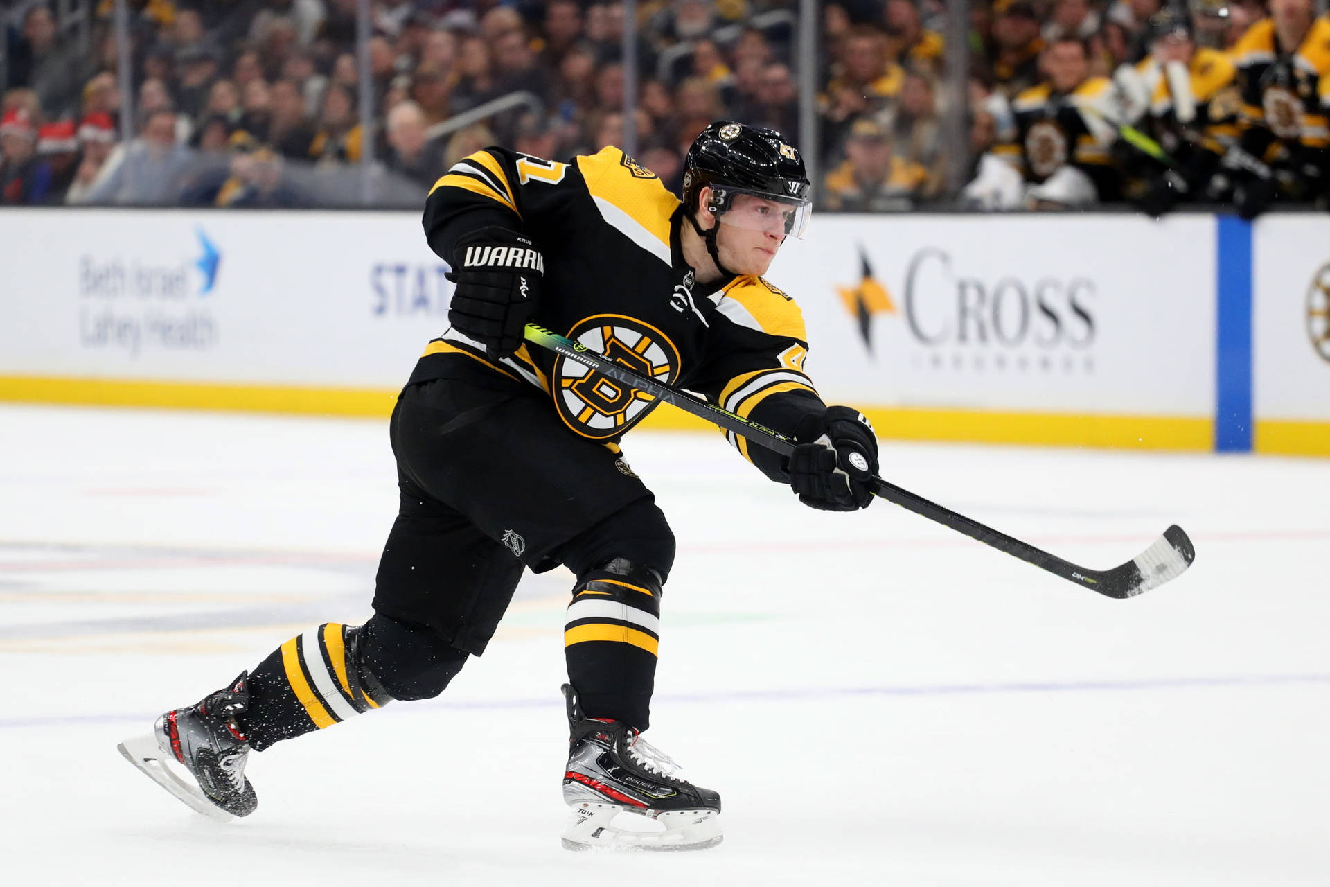 Torey Krug Attempts To Shoot A Goal Background