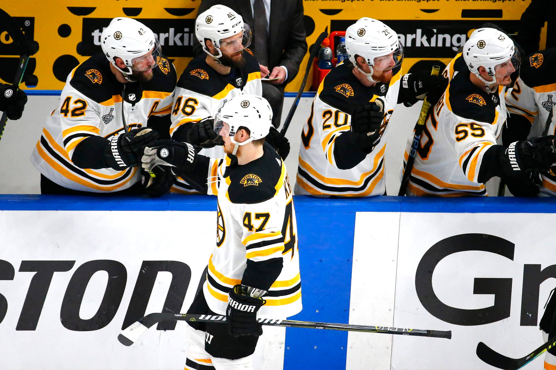 Torey Krug High Five With Teammates Background