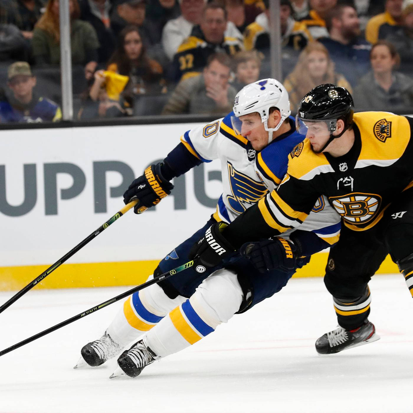 Torey Krug Tries To Take Puck