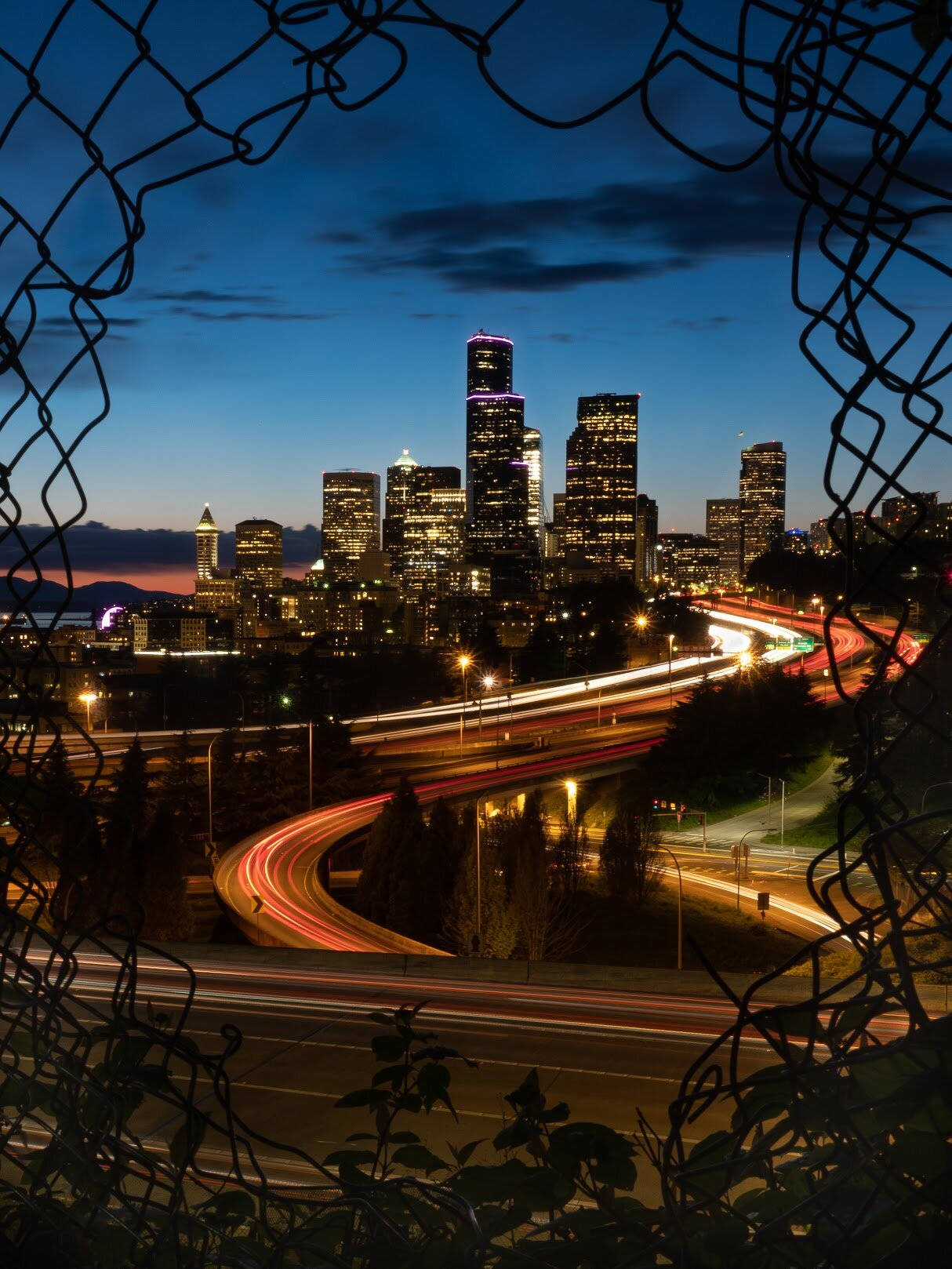 Torn Metal Mesh Seattle Skyline Background