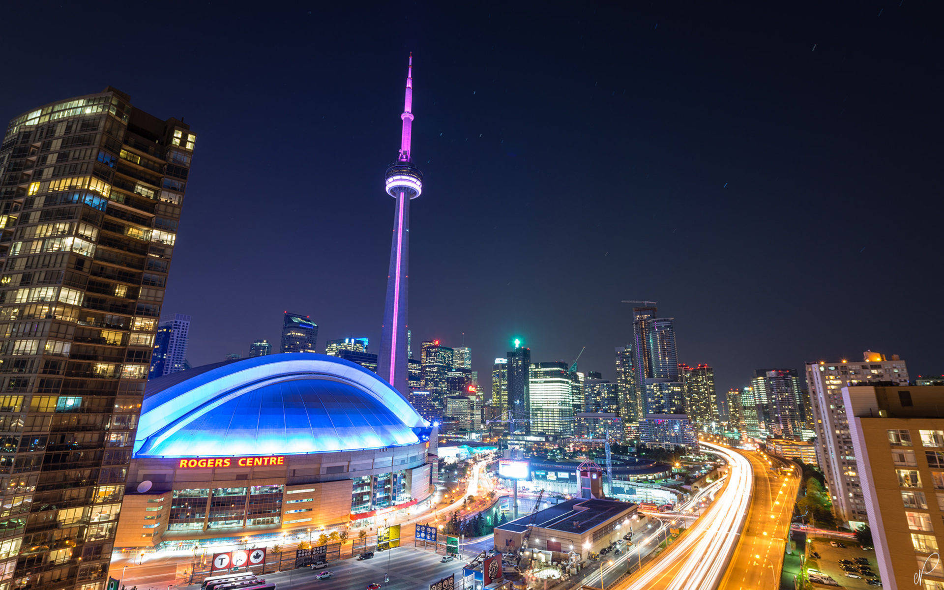Toronto City Skyline, Illuminated Against The Night Sky Background