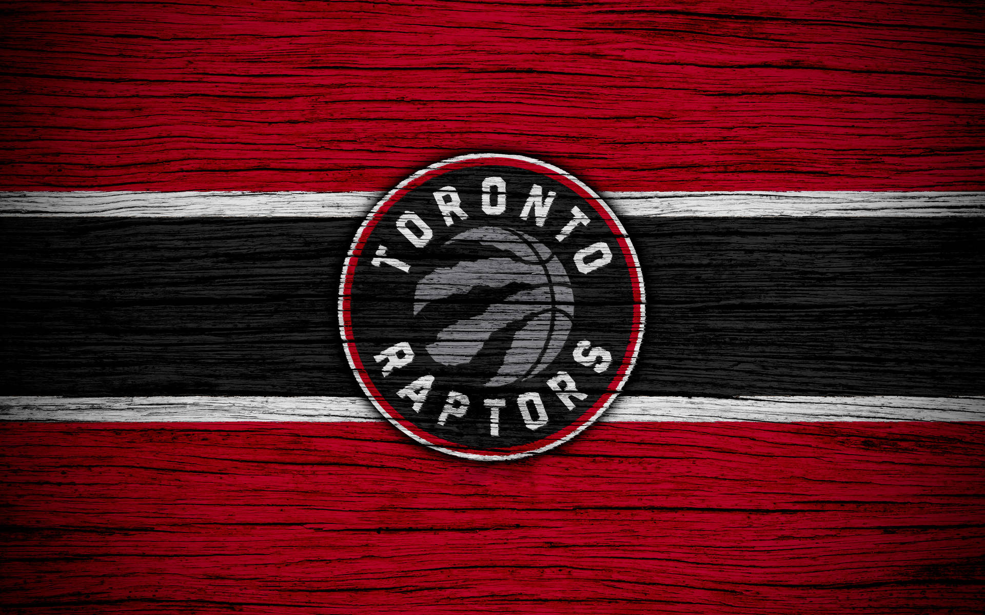 Toronto Raptors Logo On Wood Background