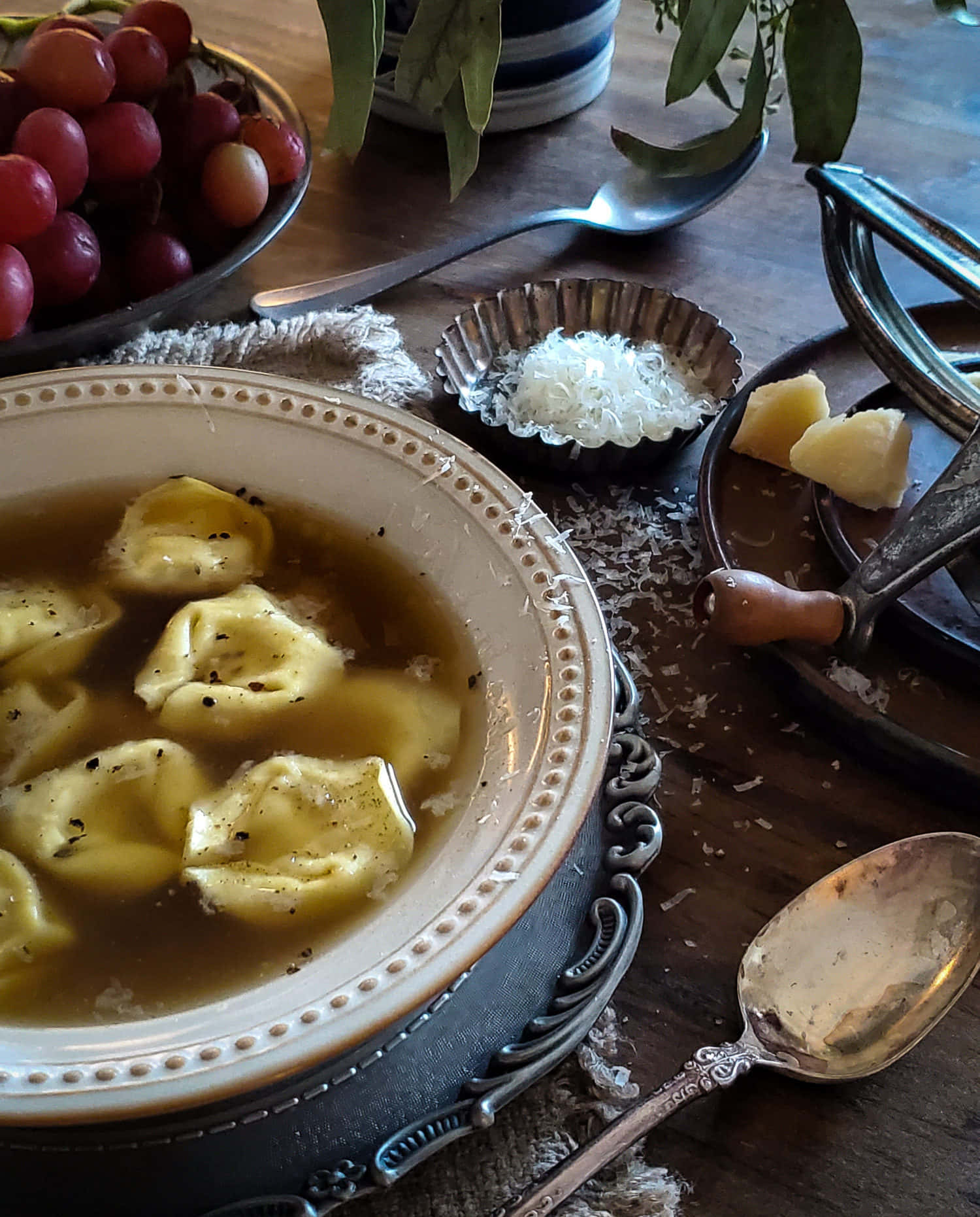 Tortellini In Brodo And Grapes Background