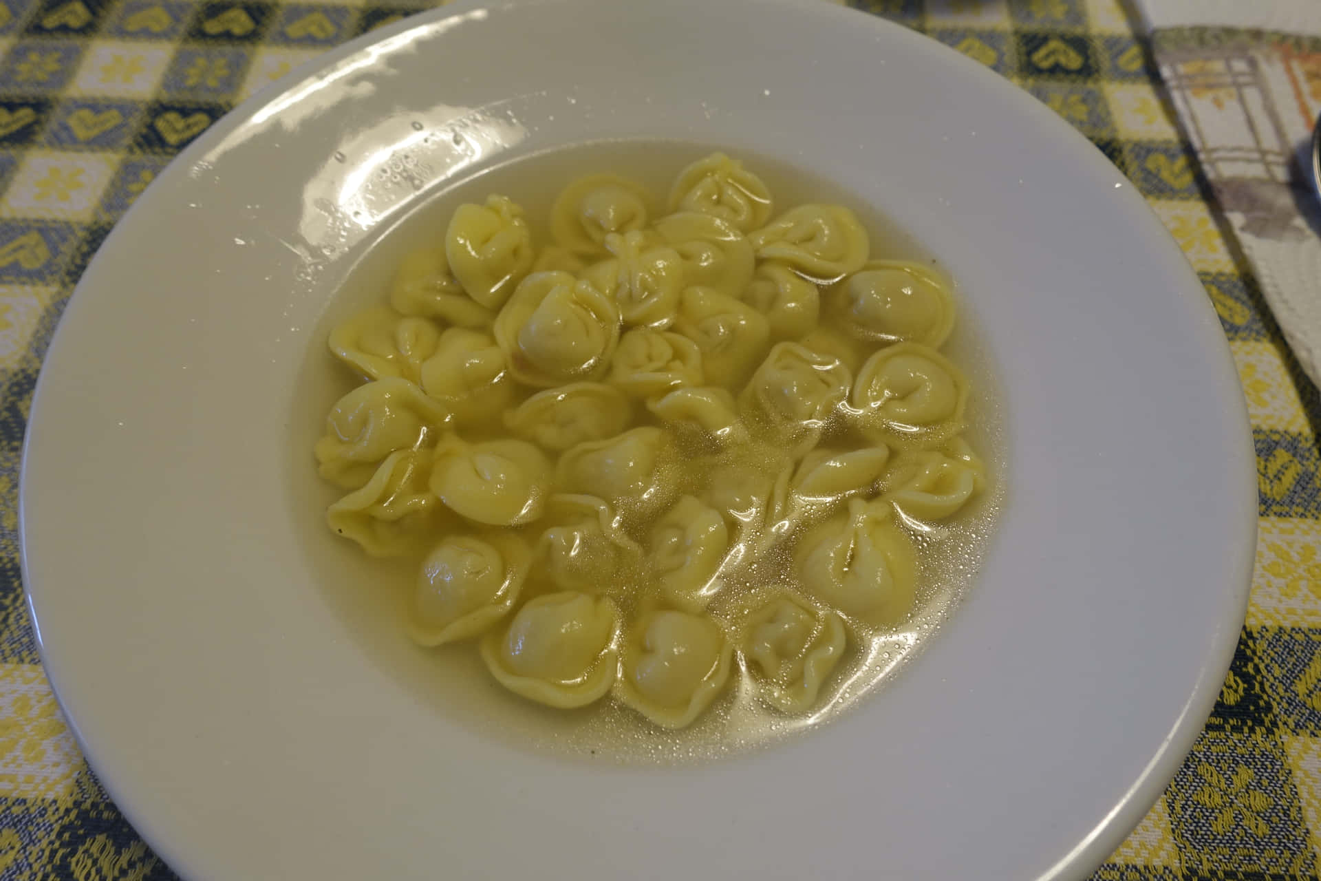 Tortellini In Brodo On A White Plate Background