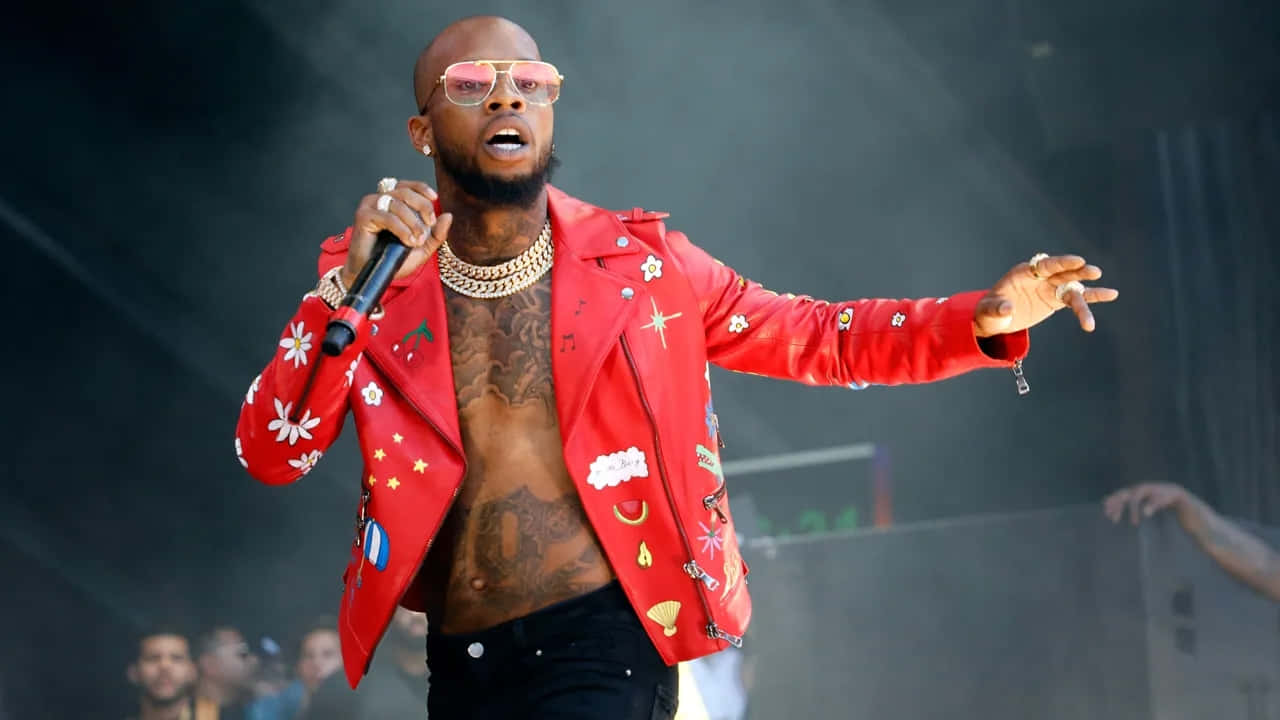 Tory Lanez Performing Live Red Jacket Background