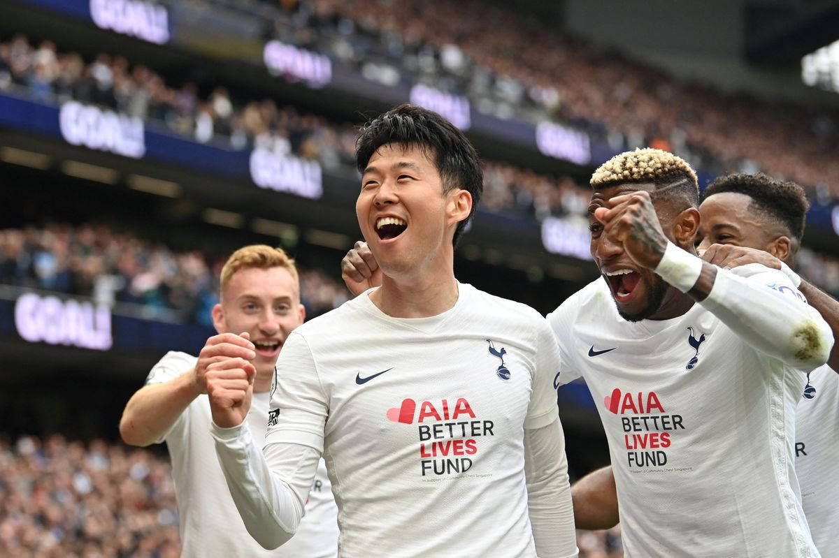 Tottenham Hotspurs Fc Members Cheering In White Background