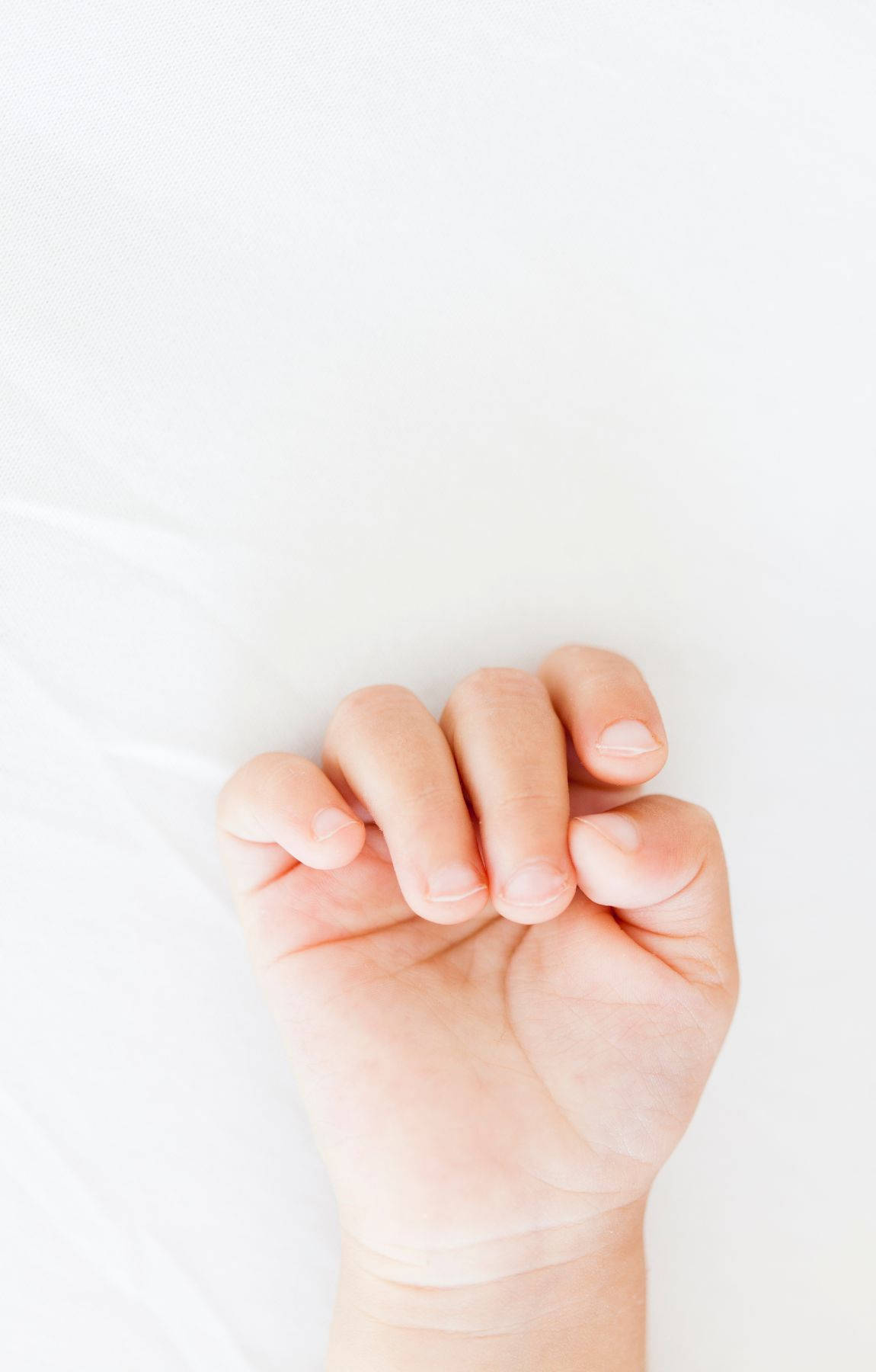 Touch Of Innocence - Tiny Baby Hand Background