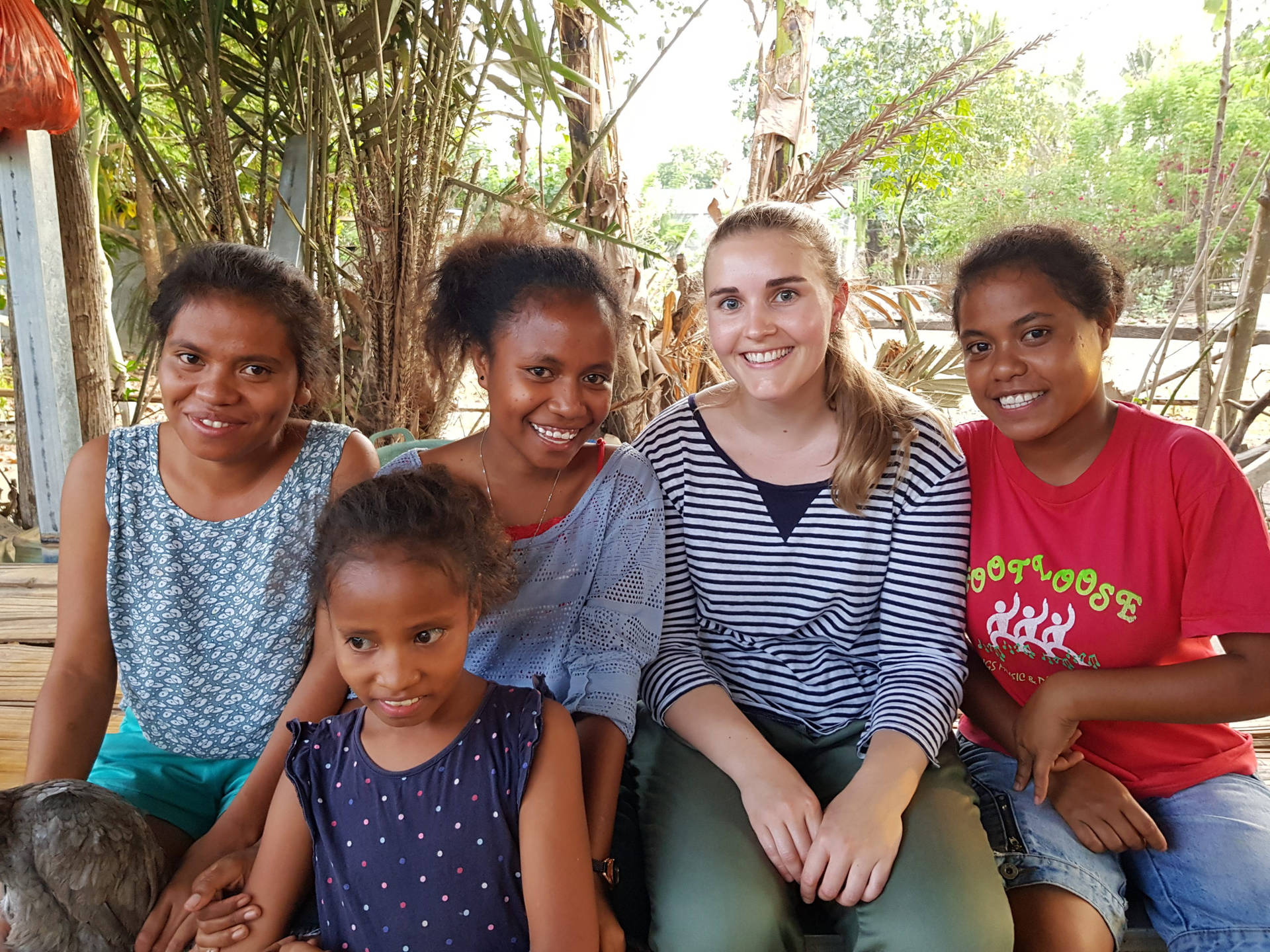 Tourist Interacting With Locals In Timor-leste