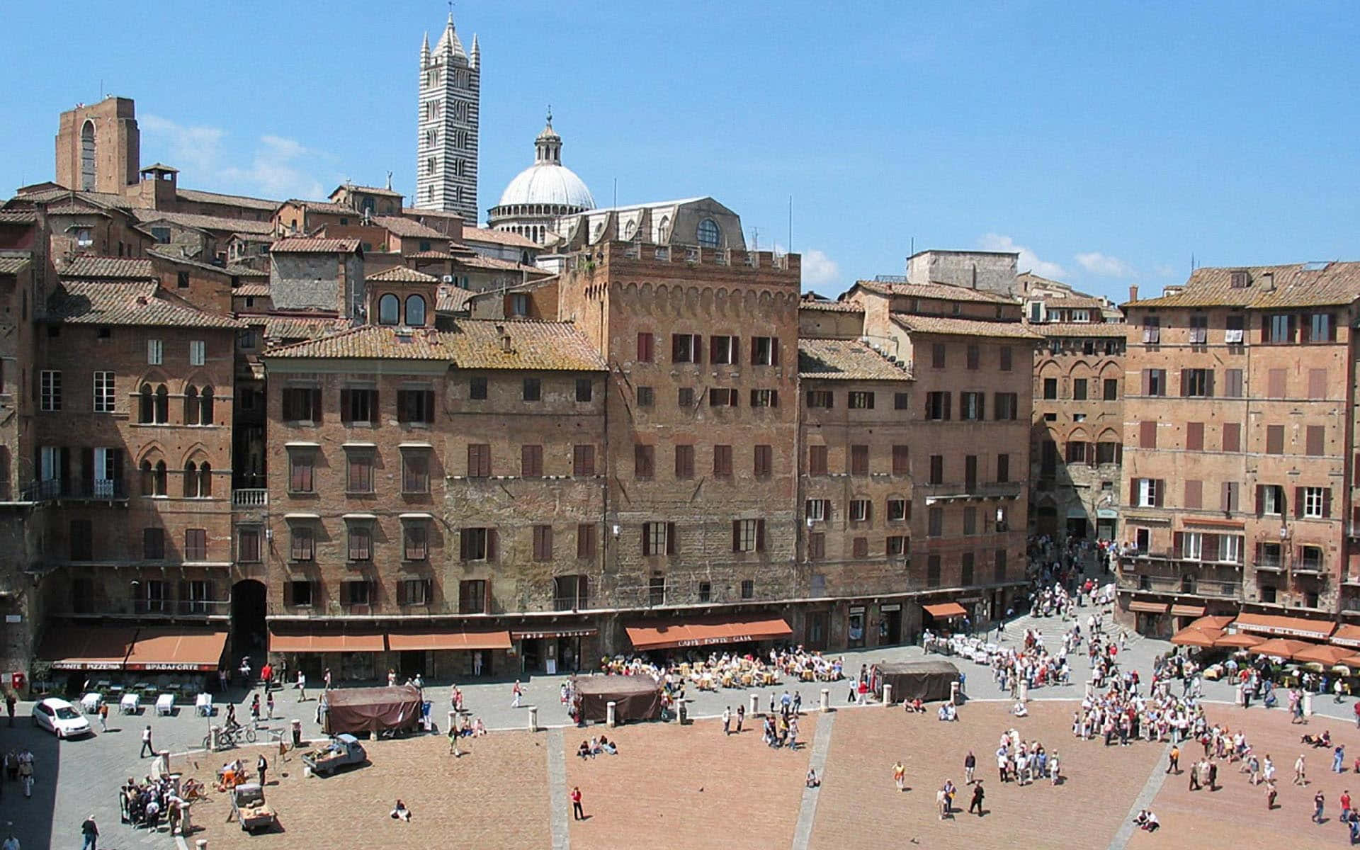 Tourist Visiting Piazza Del Campo In Siena
