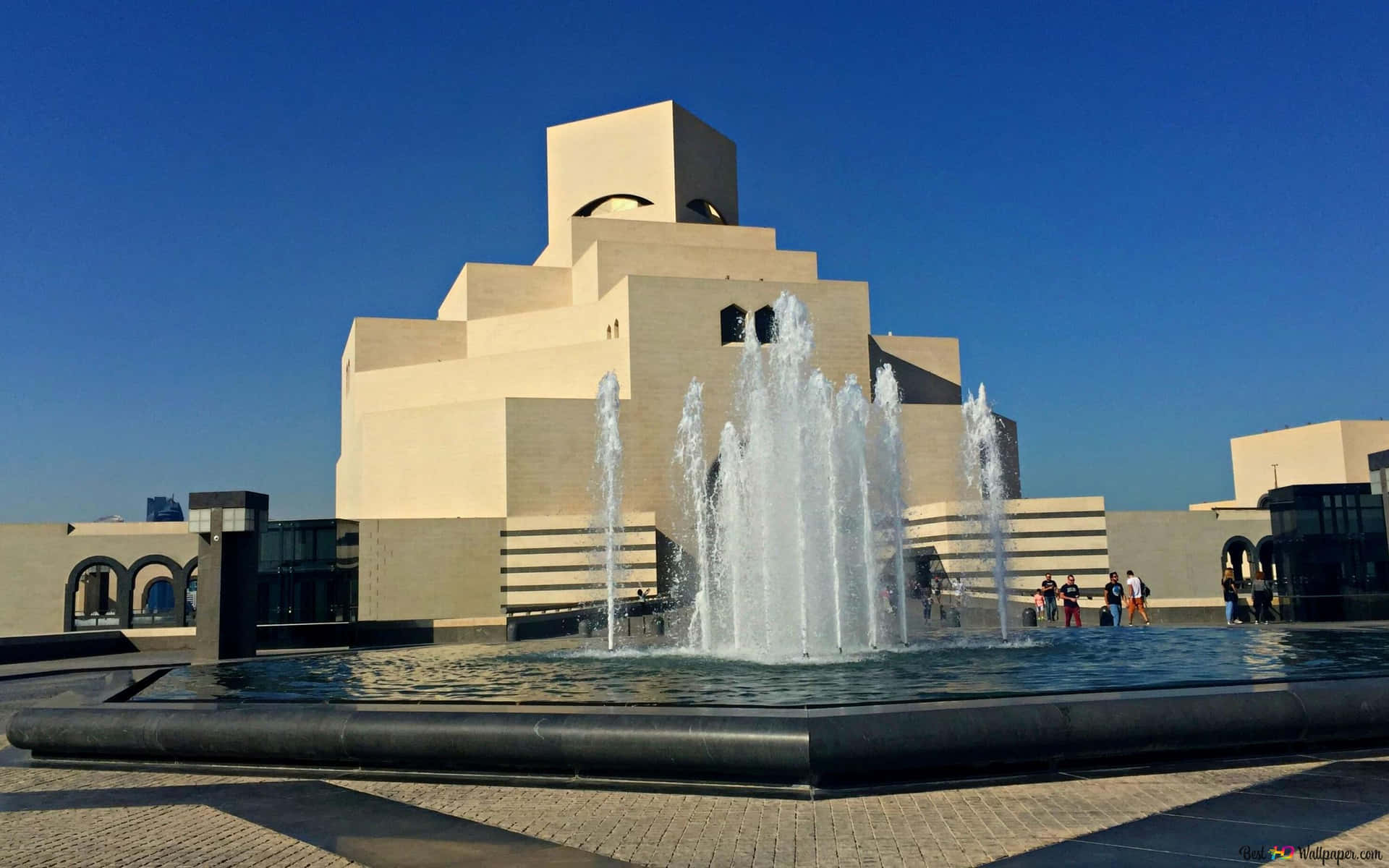 Tourists Around The Museum Of Islamic Art Background