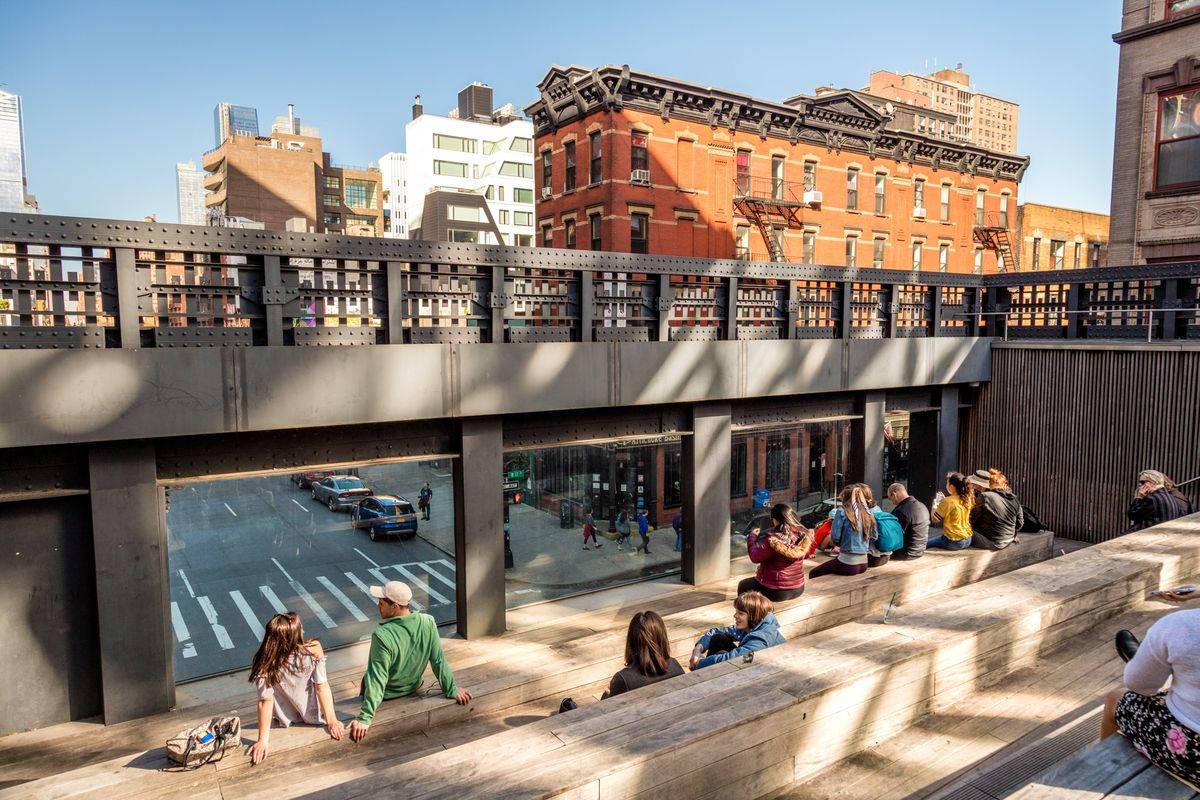 Tourists Enjoying Their Time At The High Line In New York City Background