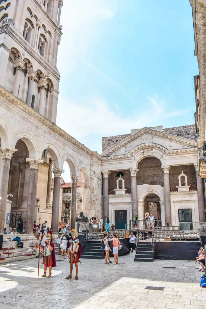 Tourists Exploring Historical Diocletian's Palace, Croatia Background