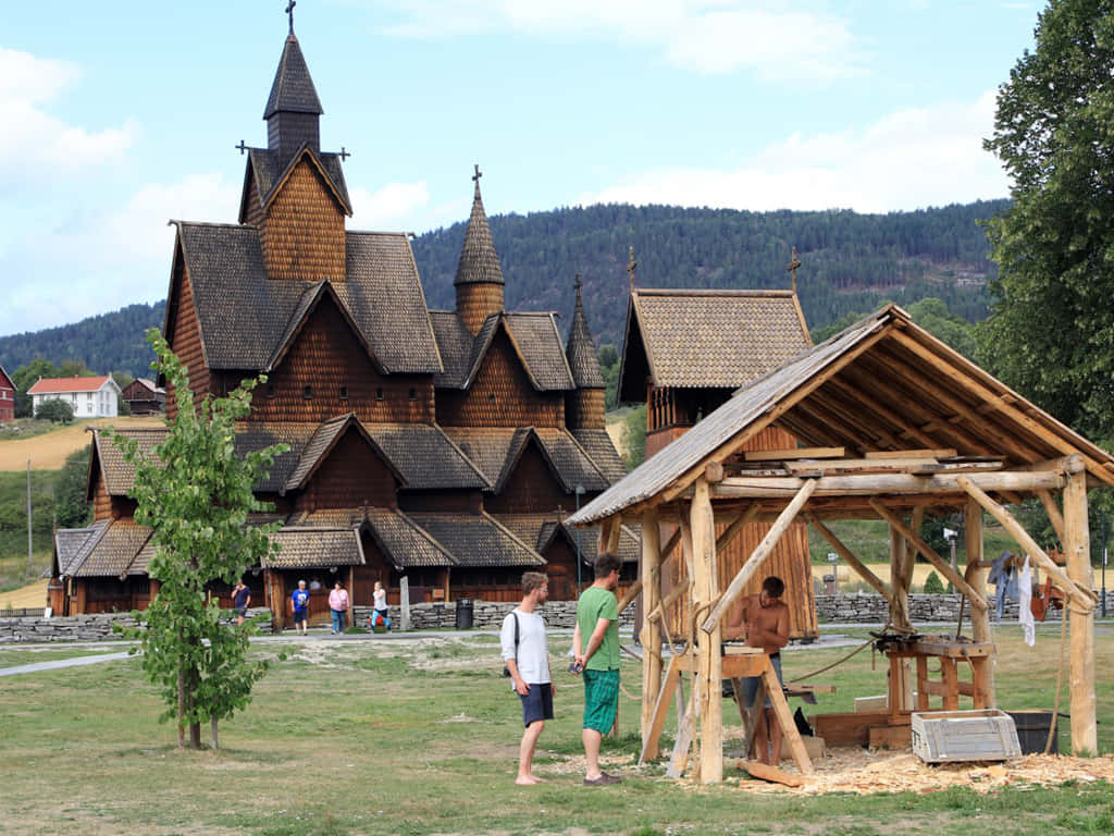 Tourists Exploring The Majestic Heddal Stave Church