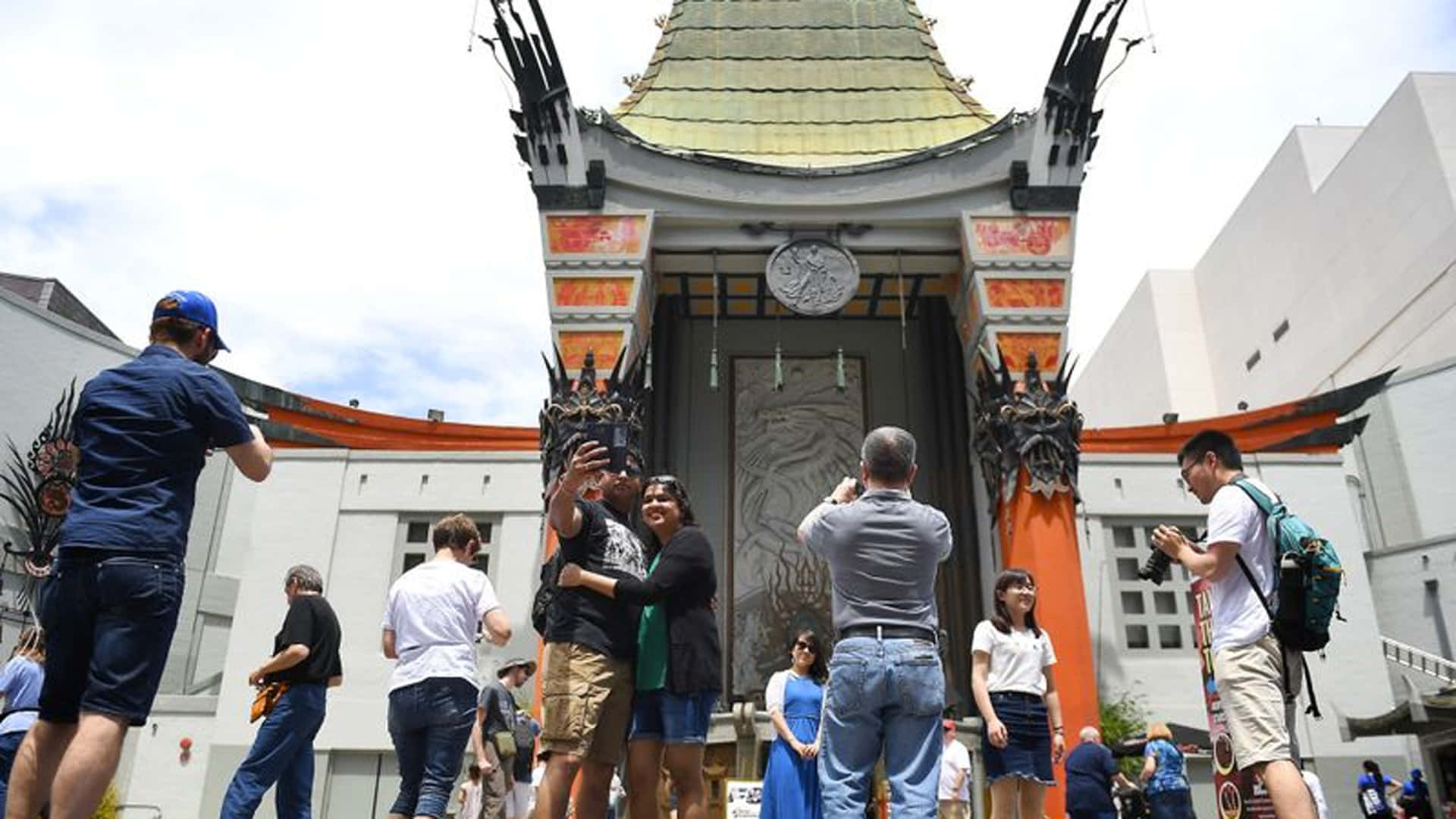 Tourists Outside Graumans Chinese Theatre Background