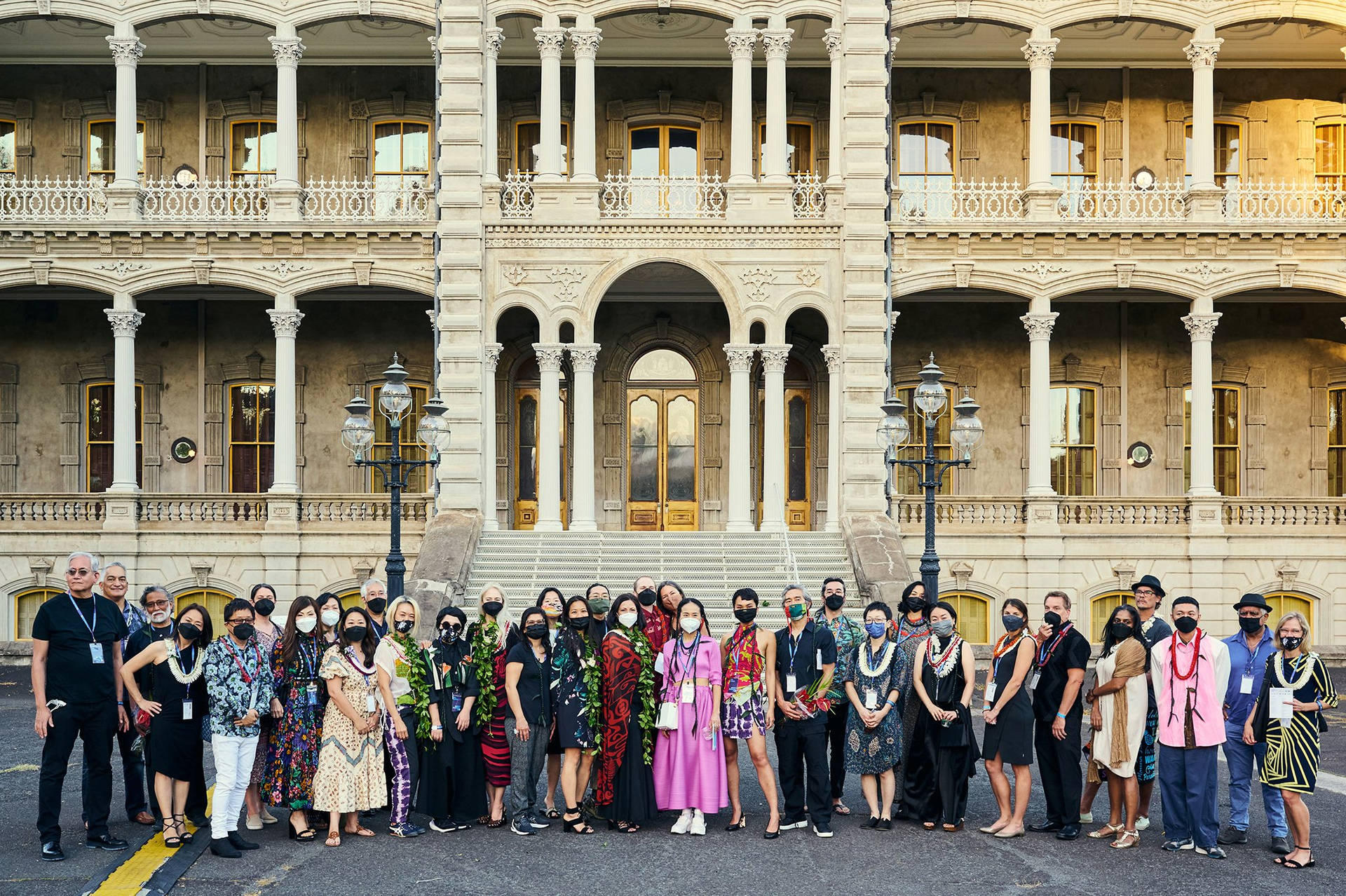 Tourists Posing In Front Iolani Palace Background