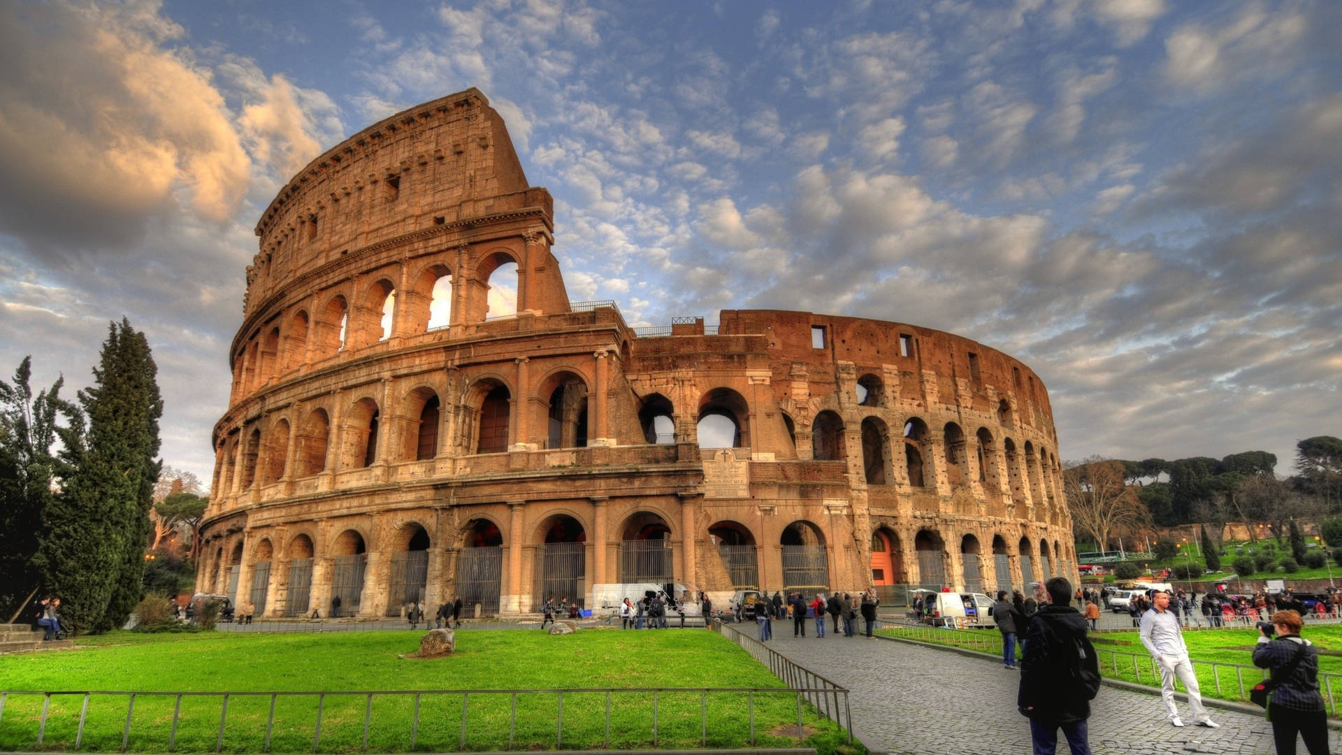 Tourists Taking Pictures Outside The Colosseum