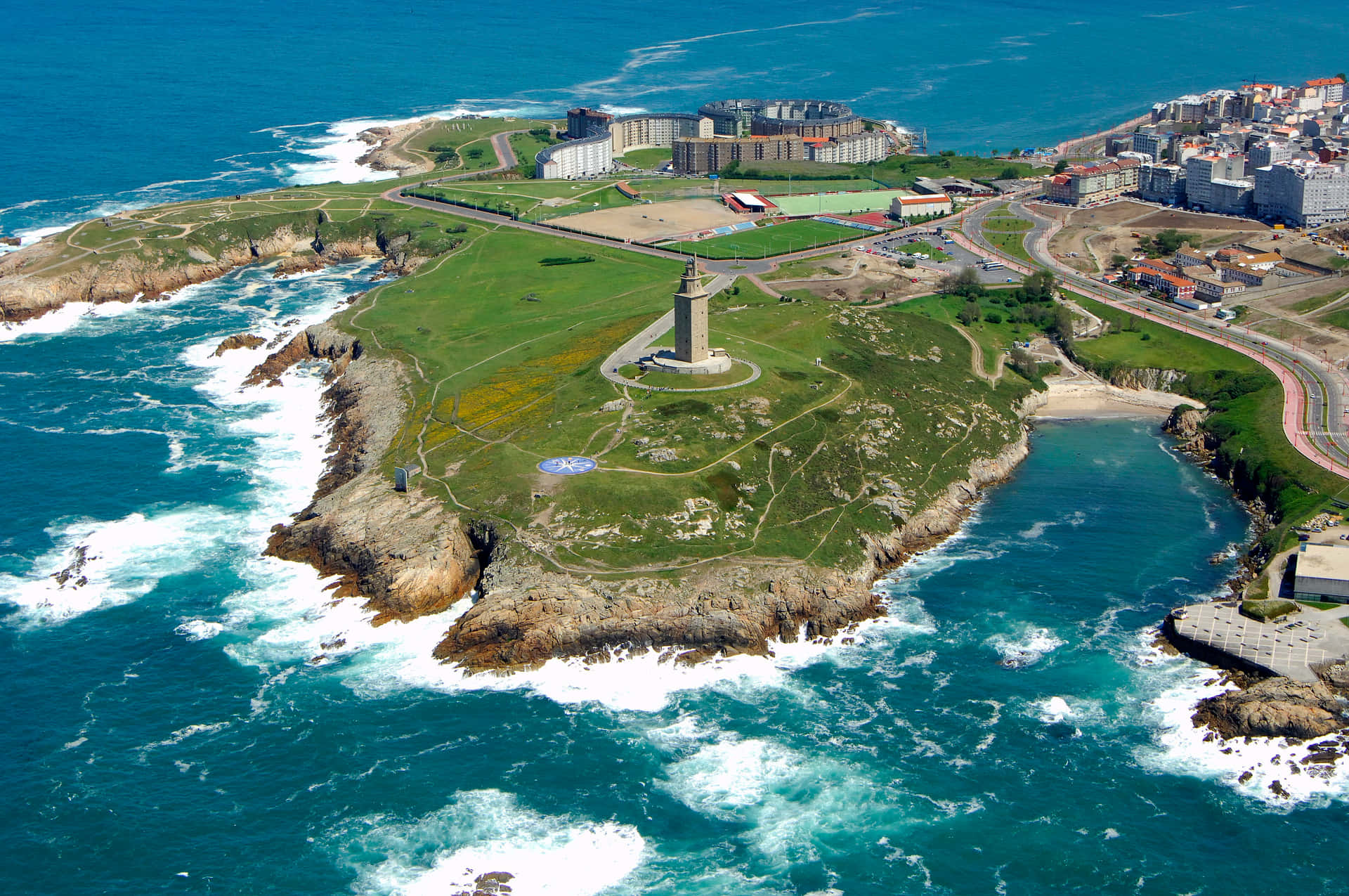 Tower Of Hercules Along Coast Above The Ocean Background