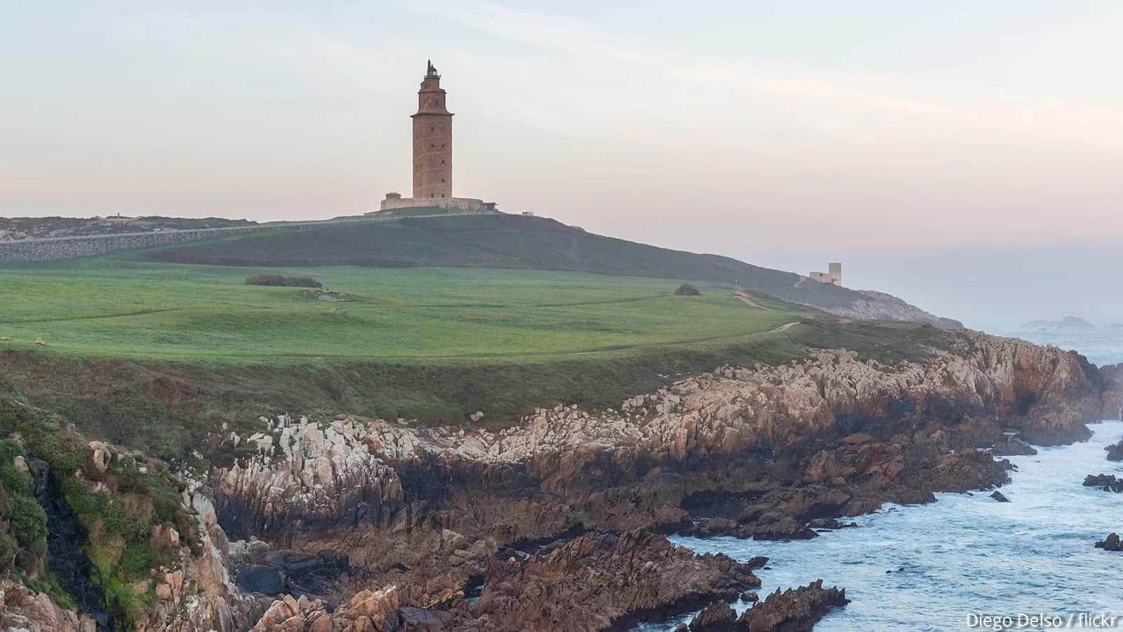 Tower Of Hercules Ocean Waves Below Background