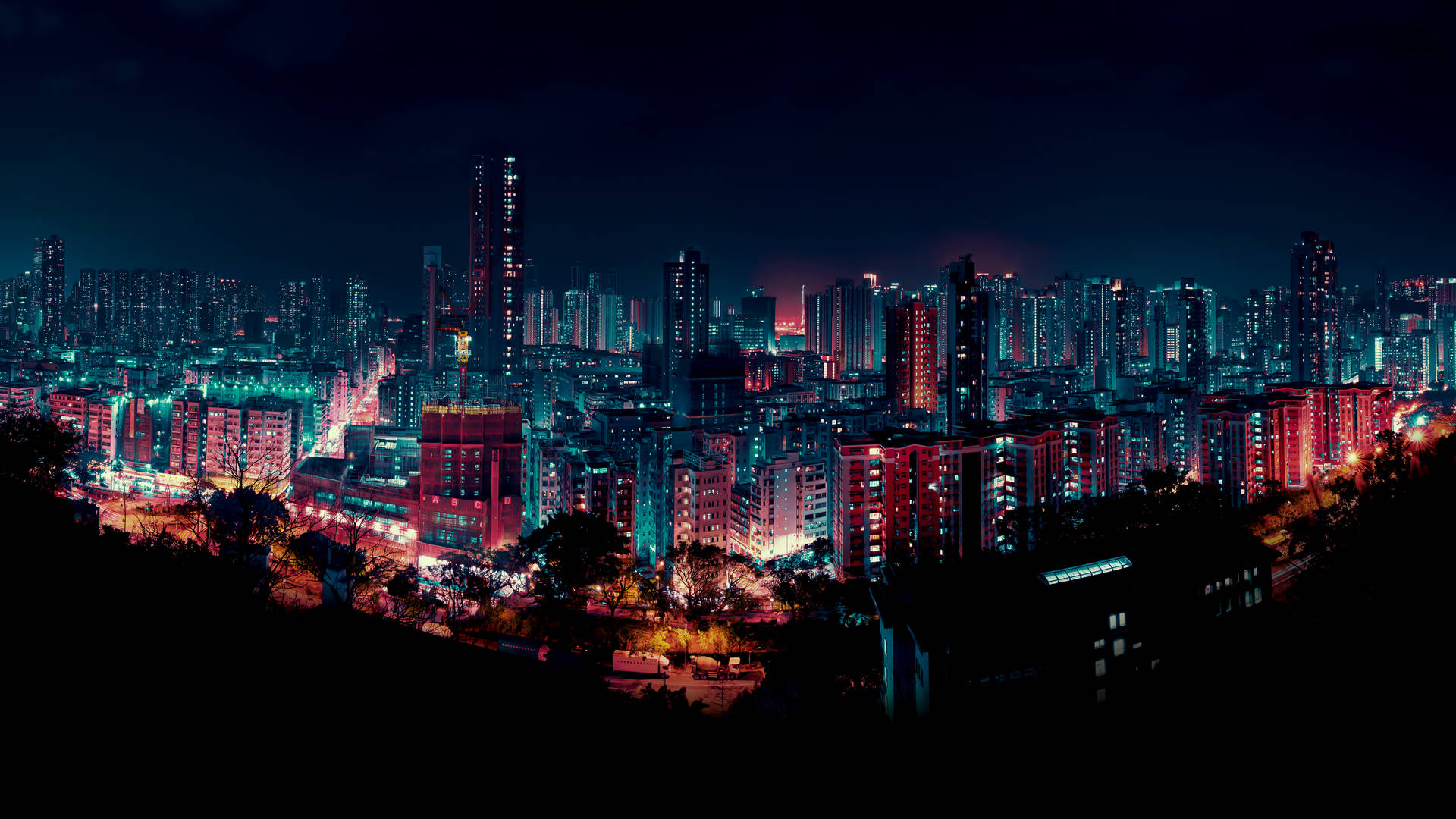 Towering Buildings Neon City At Night Background