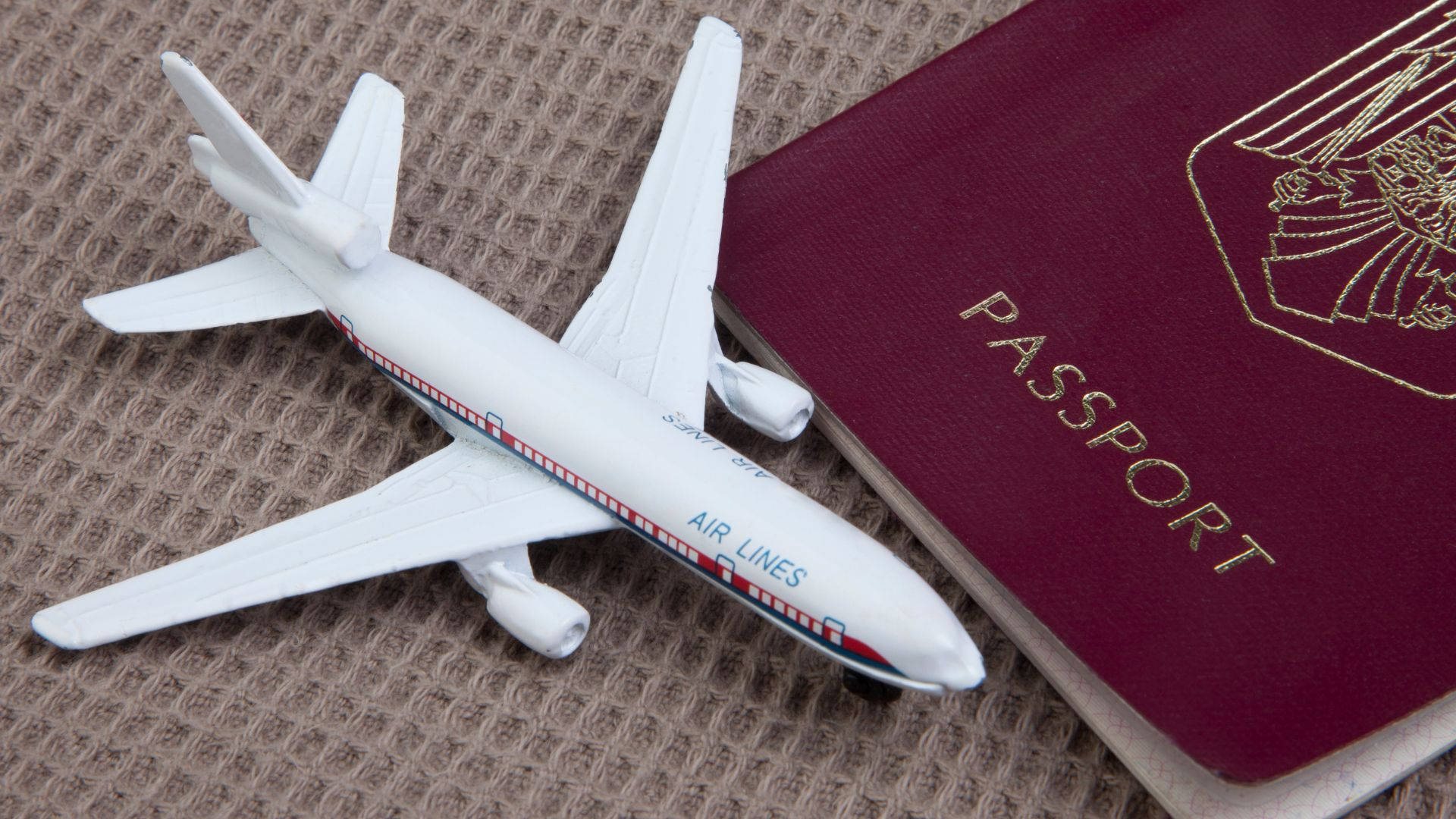 Toy Airplane With Passport Background