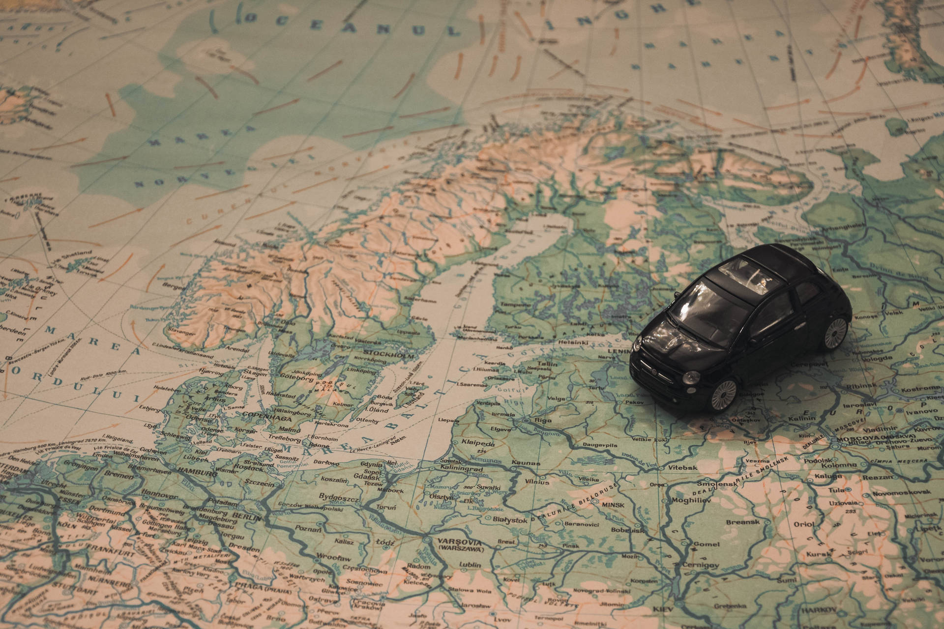 Toy Car With Countries Map Background