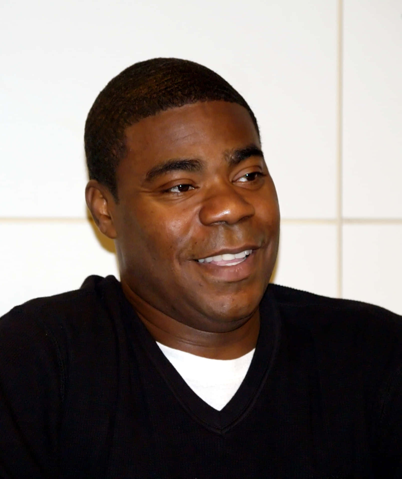 Tracy Morgan Posing For A Photoshoot Background