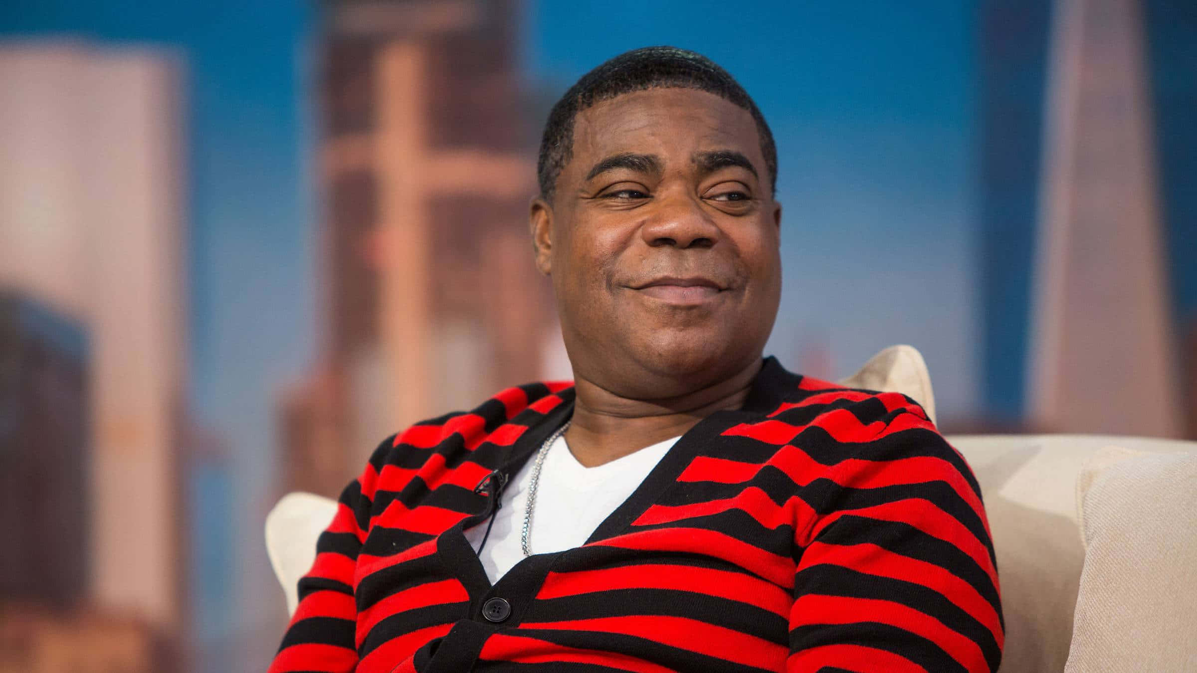 Tracy Morgan - Smiling On Stage In Front Of Camera Background