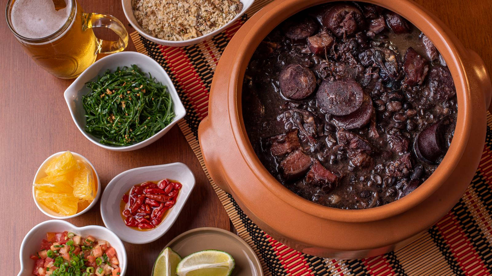 Traditional Brazilian Bean Stew Feijoada With Beer Background