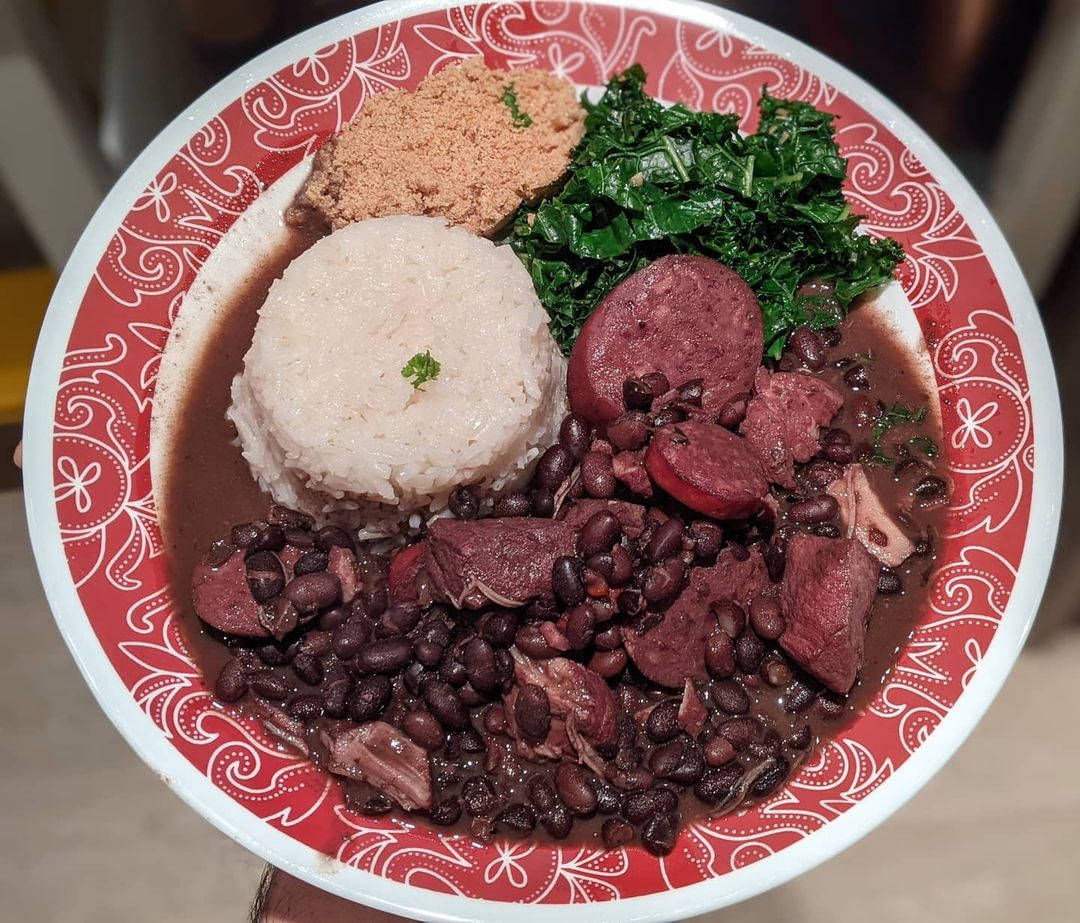 Traditional Brazilian Feijoada - A Savory Black Bean Stew With Sausage Background