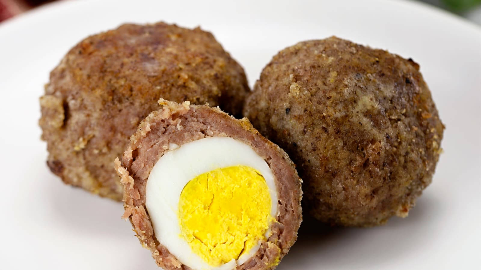 Traditional British Scotch Eggs Dish Half Slice Background