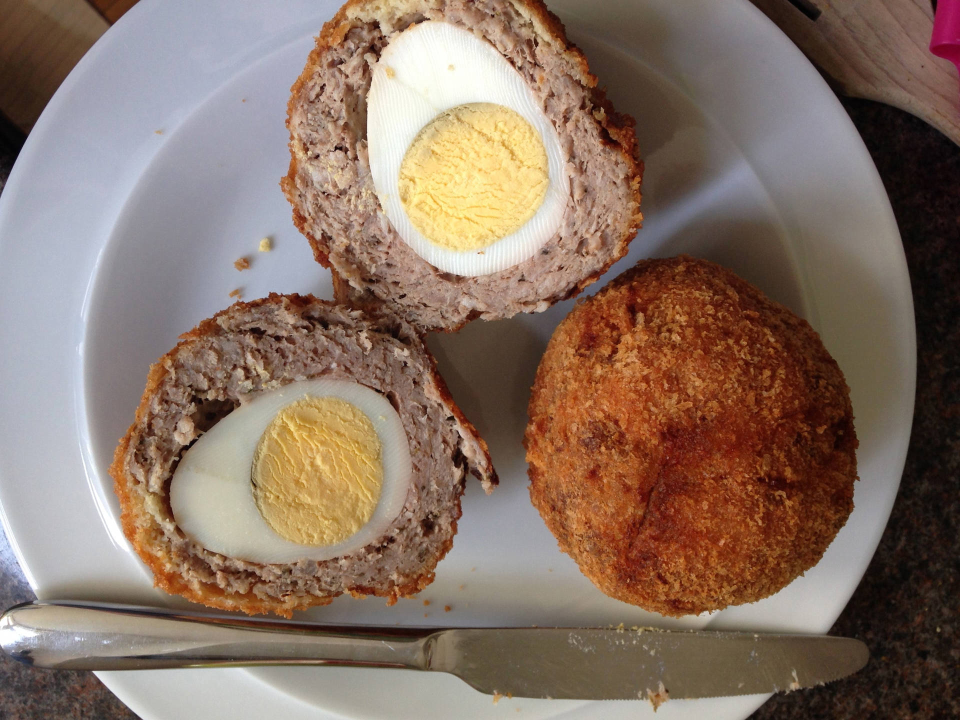 Traditional British Scotch Eggs Dish With Dinner Knife Background