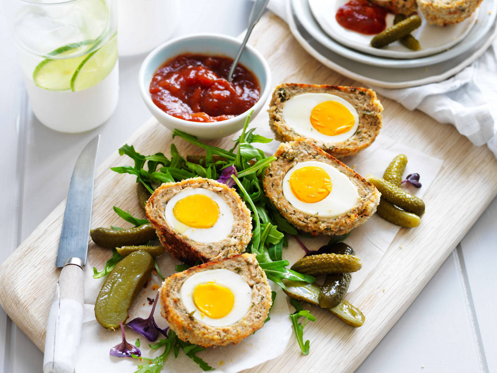 Traditional British Scotch Eggs Dish With Pickles And Vegetables Background