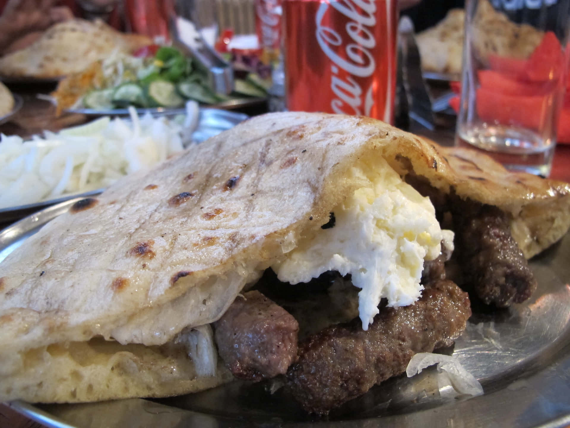 Traditional Cevapi Sausages Paired With Refreshing Coca-cola Background