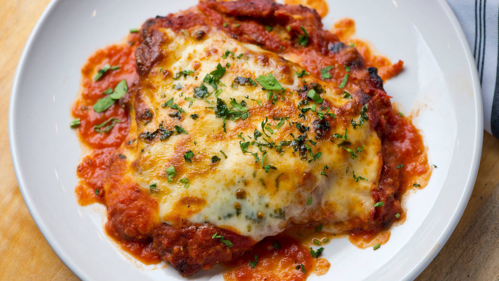 Traditional Chicken Parmigiana In Marinara Sauce Background