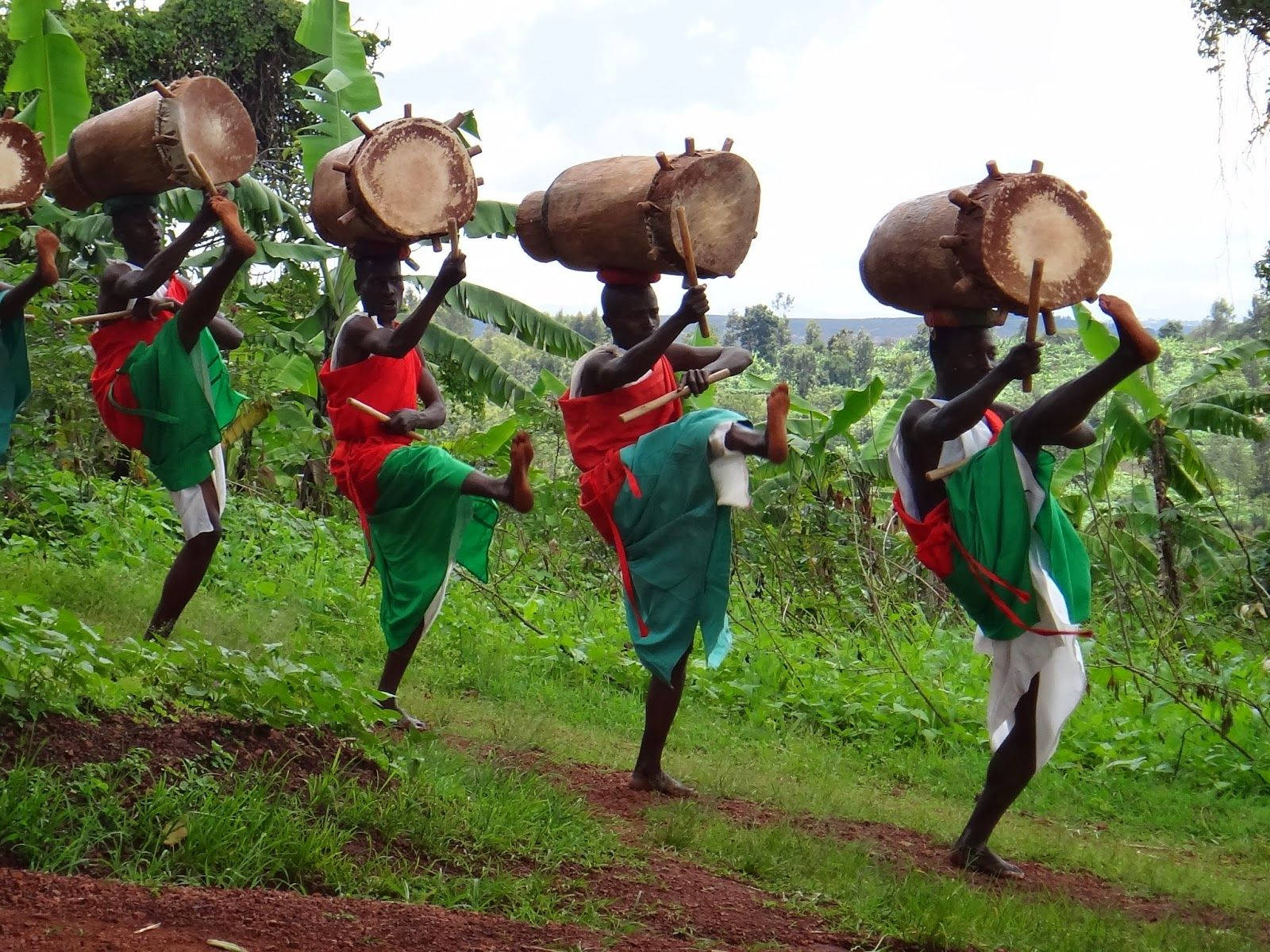 Traditional Dancers From Burundi Performing On Stage Background