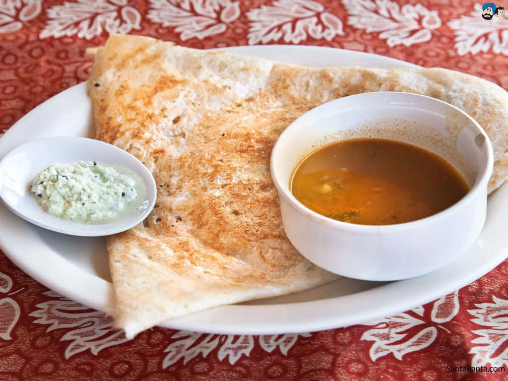 Traditional Indian Dosa With Chutney And Sambar Background