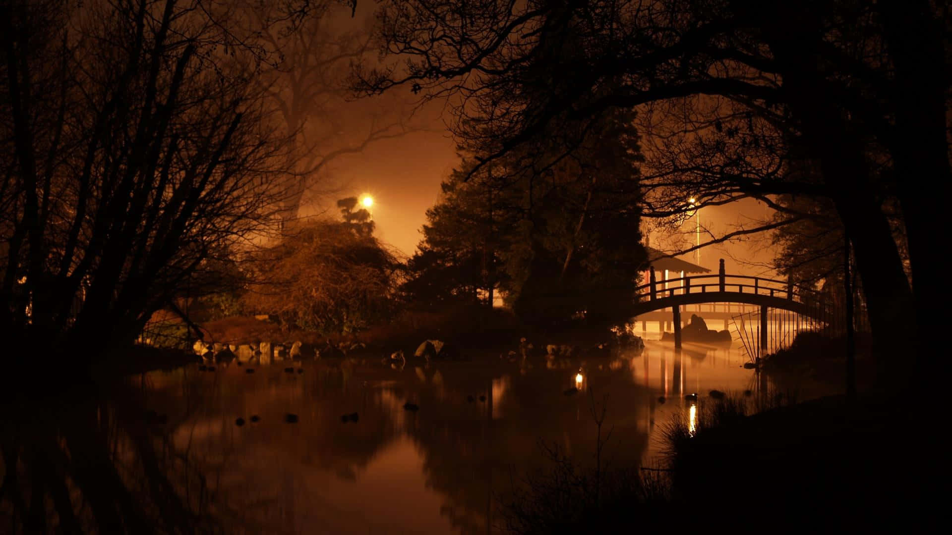 Traditional Japanese Architecture Standing Proudly Under The Dark Night Sky Background