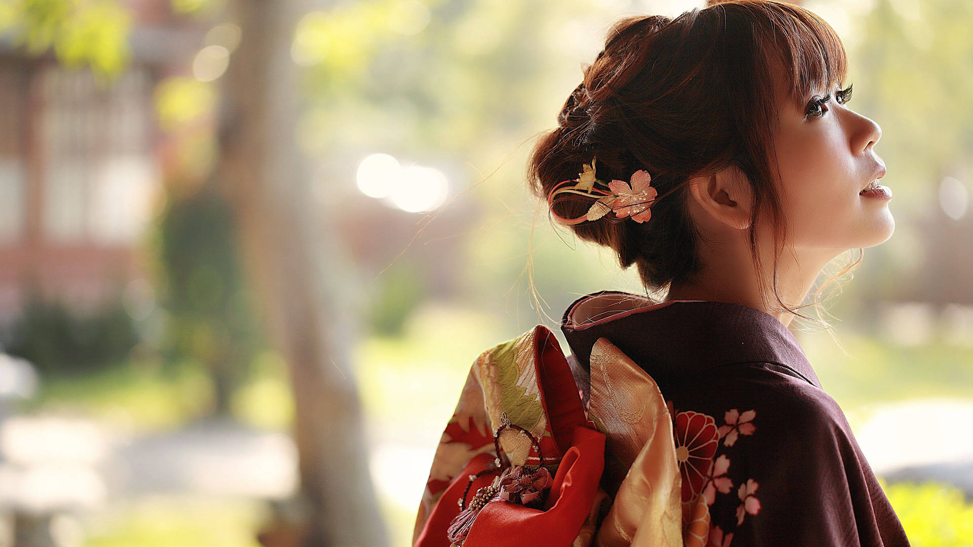 Traditional Japanese Girl With A Floral Hair Pin Background