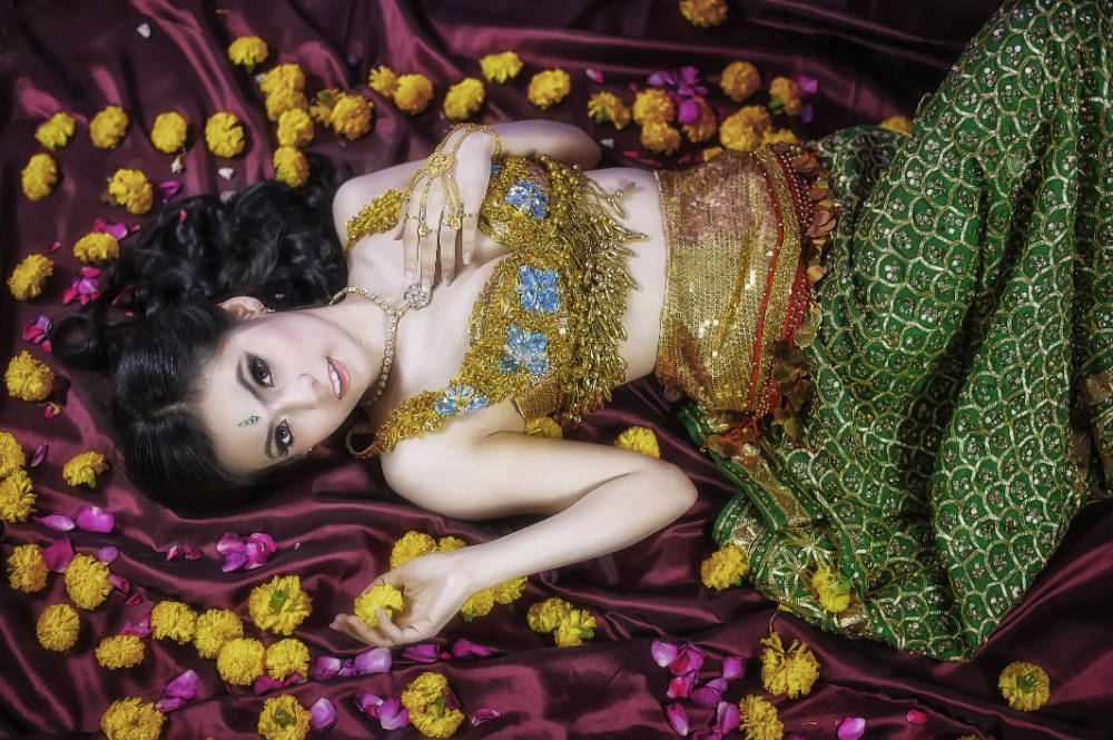 Traditional Thailand Woman With Yellow Flowers