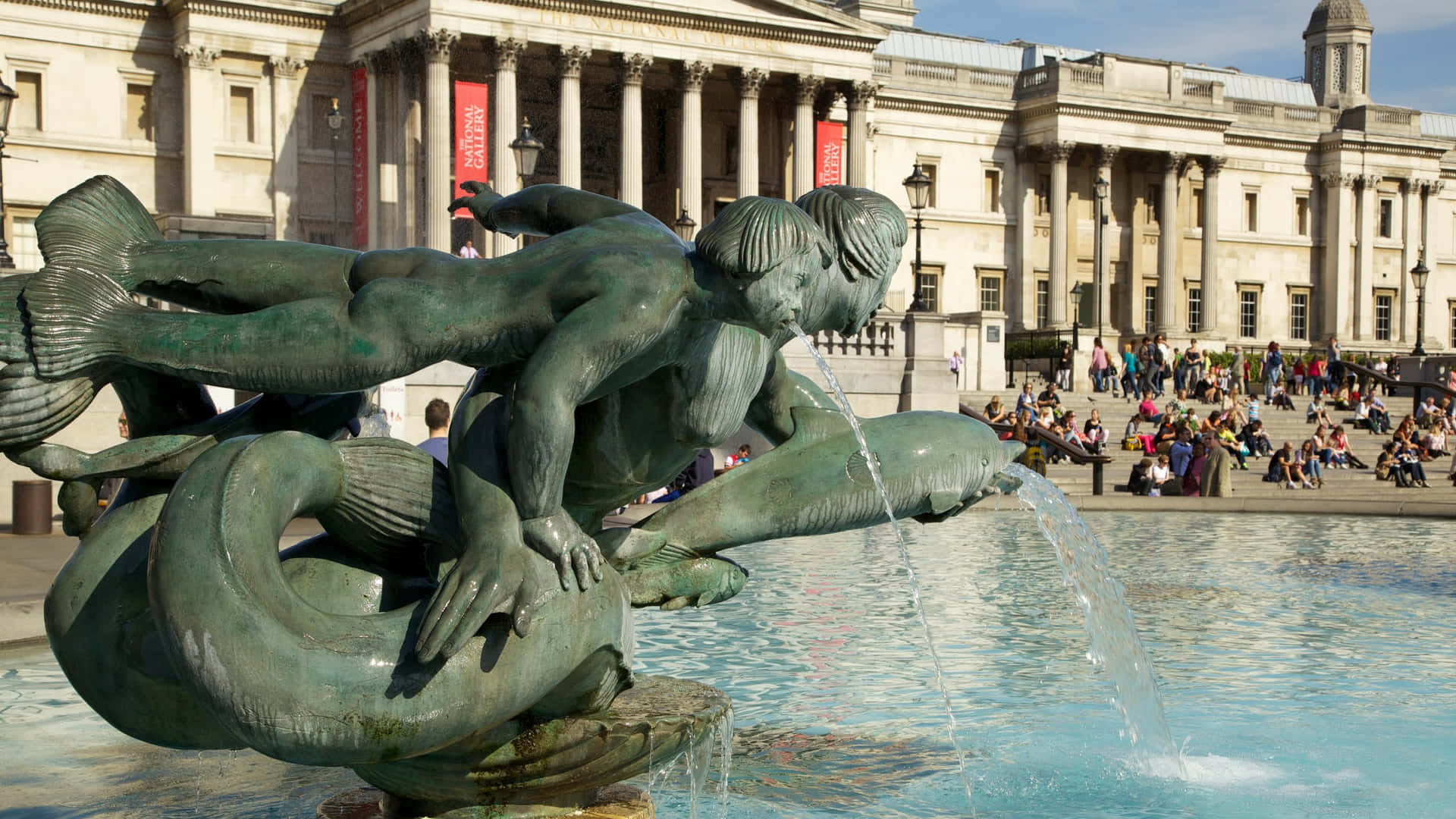 Trafalgar Square Fountain Featuring Dolphins And Mermaids Sculpture Background