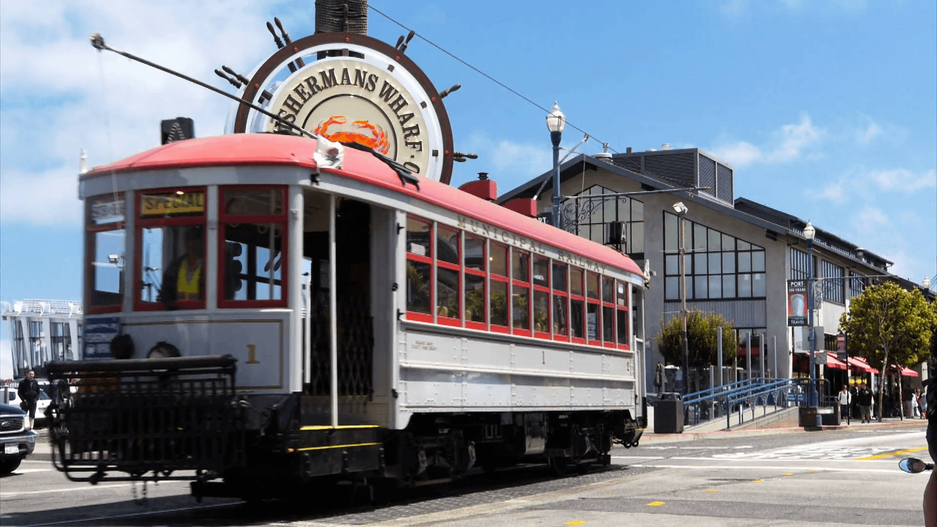 Tram Passing By Fishermans Wharf Background