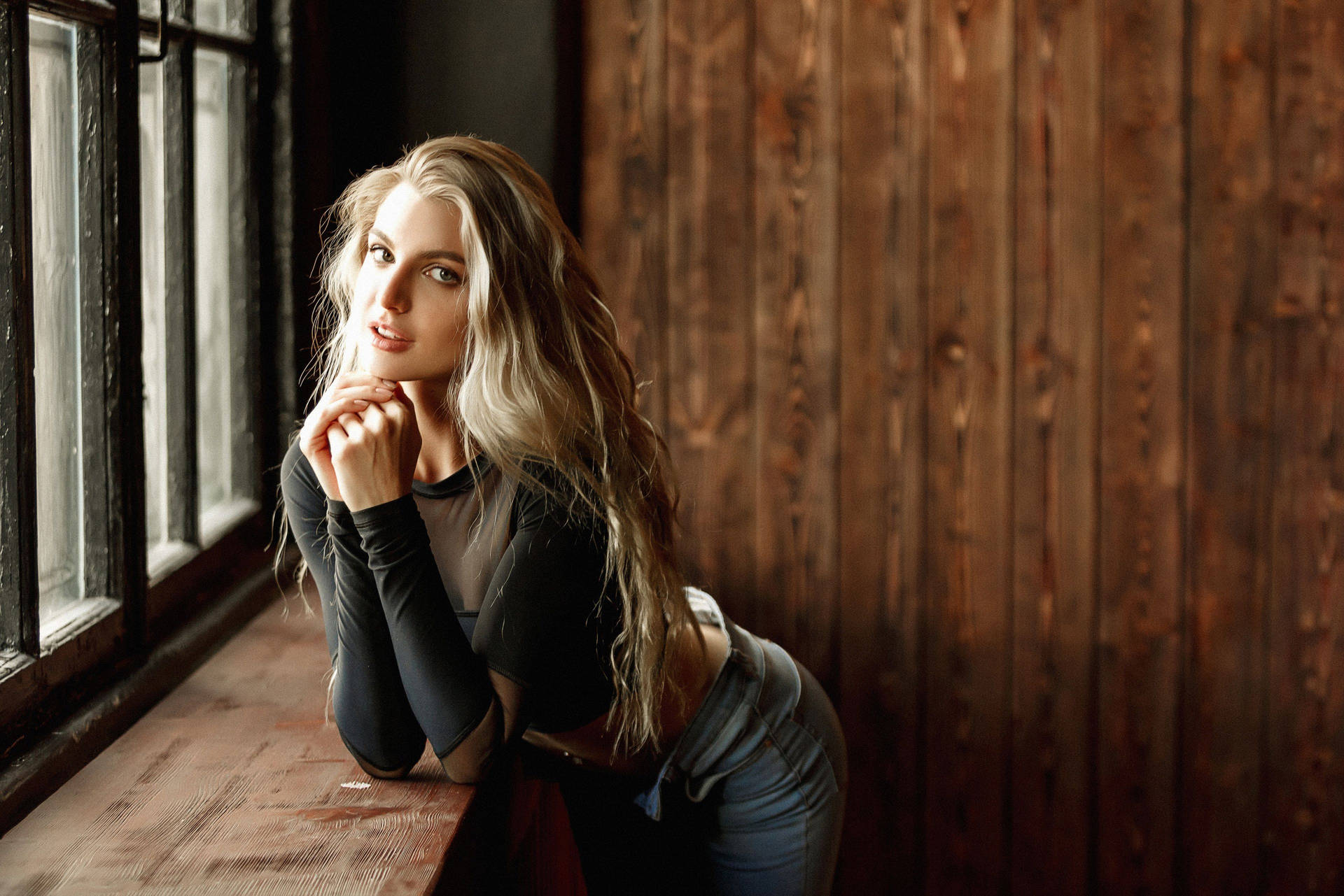 Tranquil Blonde Girl Against Wooden Wall Background