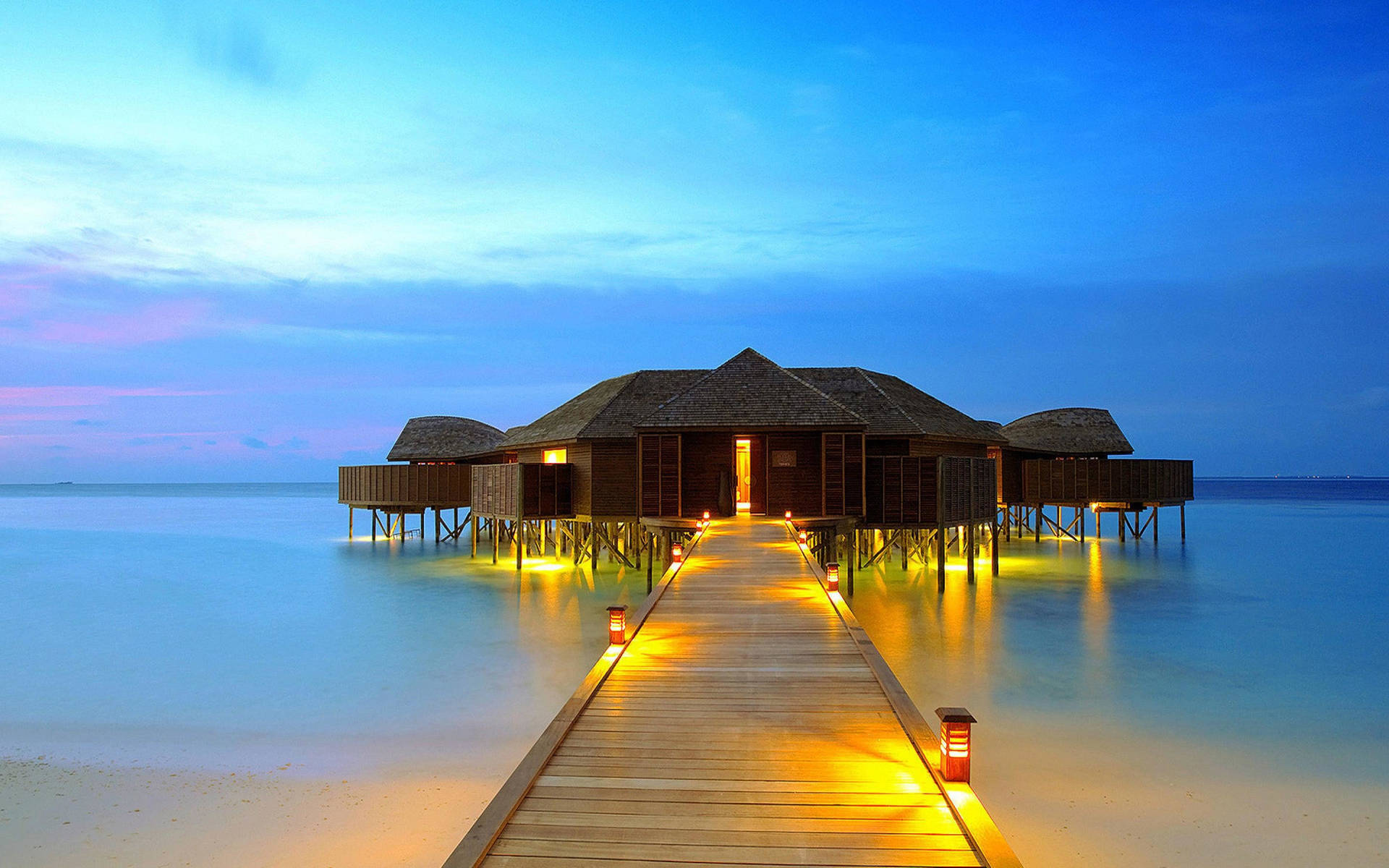 Tranquil Boardwalk On A Scenic Beach Resort Background