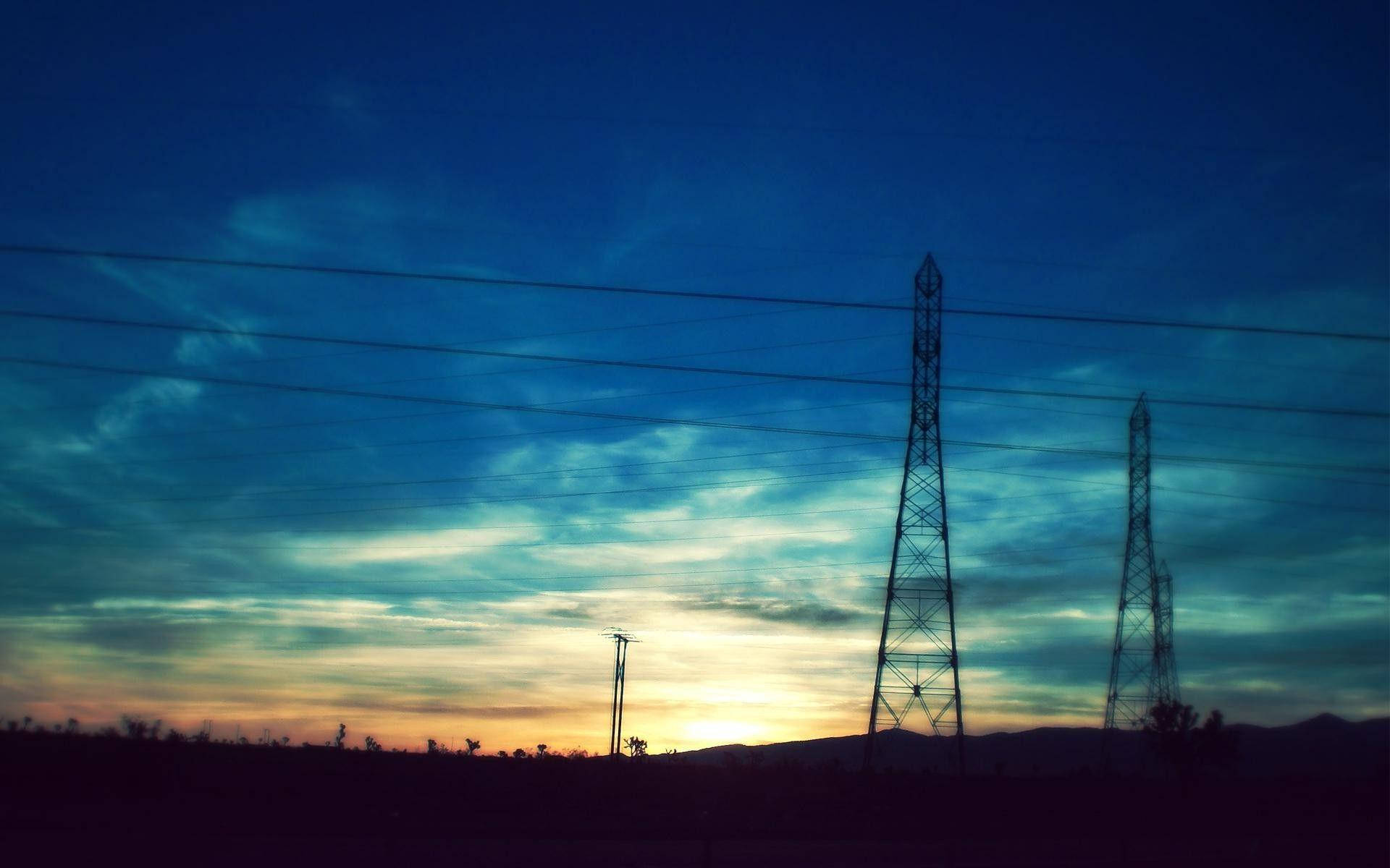 Transmission Towers With Current Sunrise View