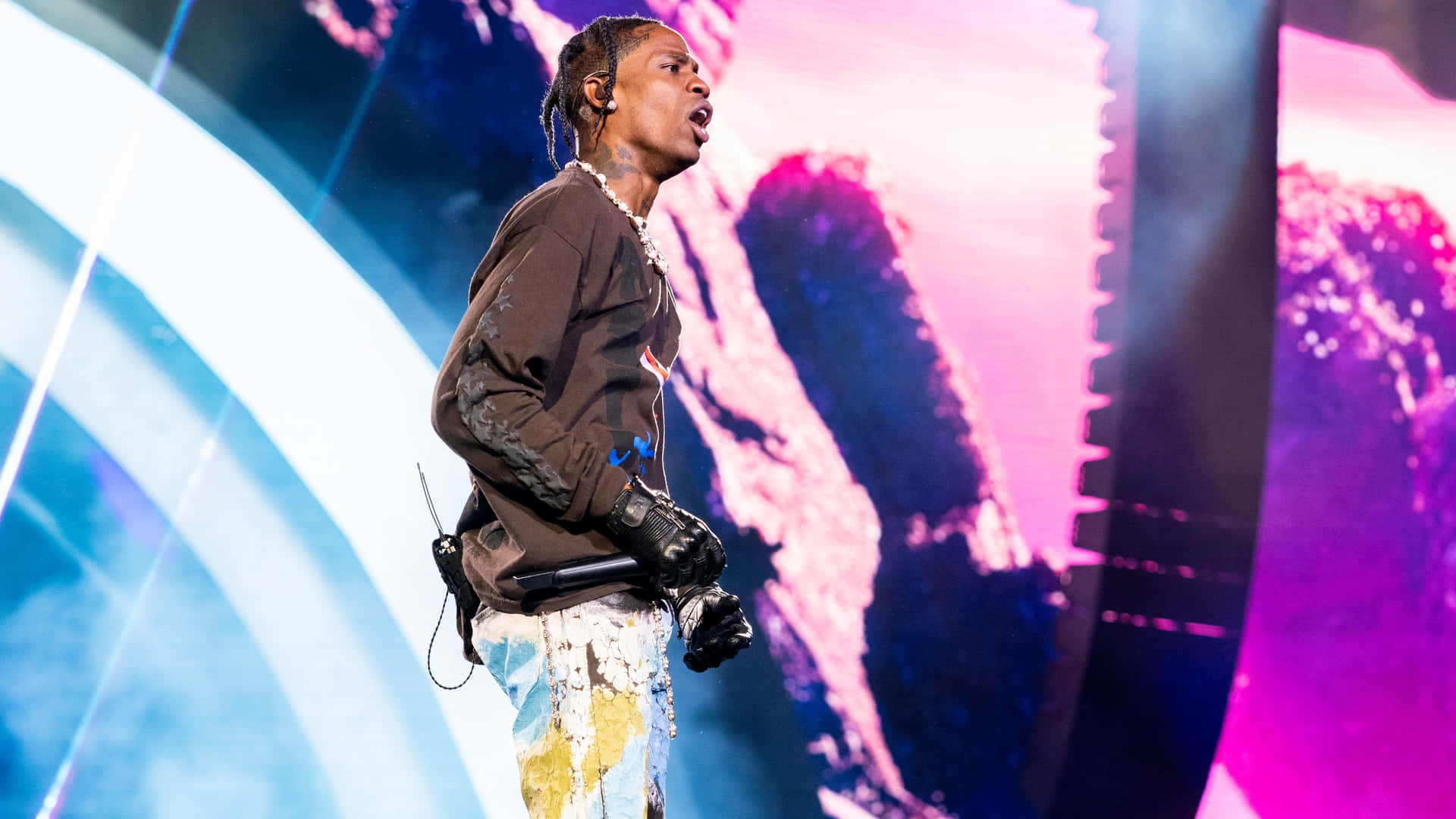 Travis Scott Electrifying The Crowd With His Performance At The Sold-out Concert Background