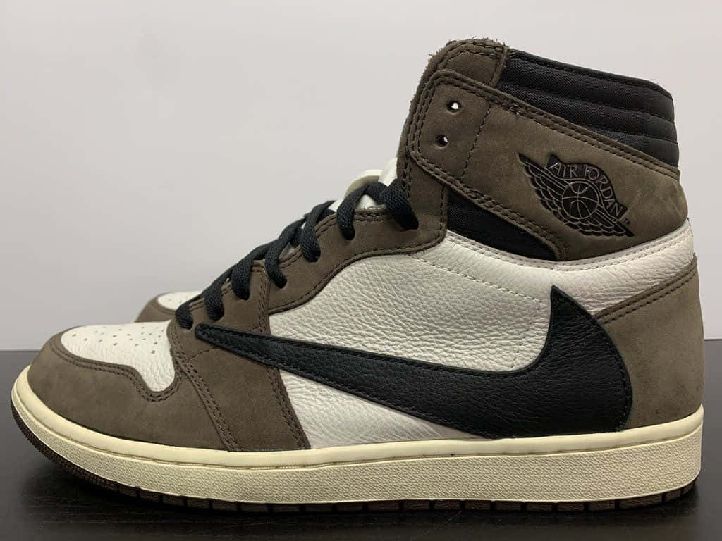 Travis Scott With His Jordan 1 Collaboration Background