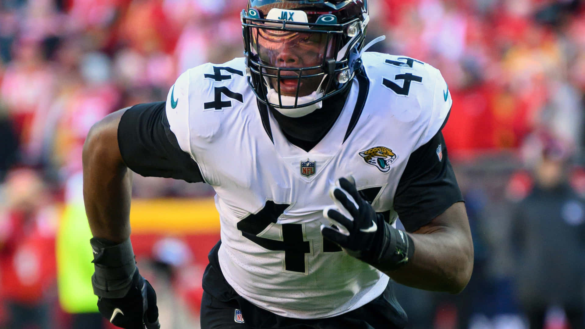Travon Walker Wearing White Jacksonville Jaguars Background